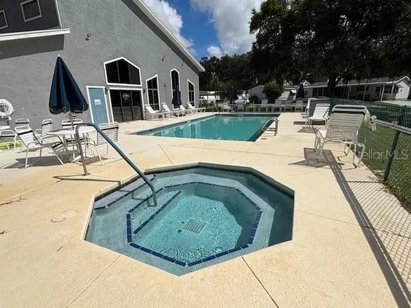 a view of a swimming pool with a patio