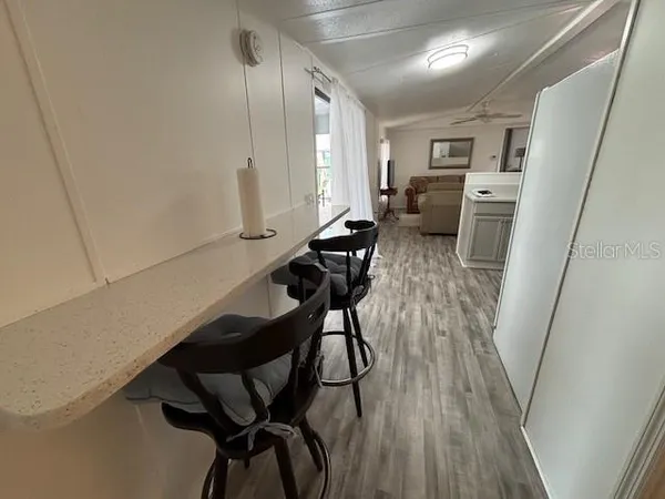 a view of a hallway with seating area