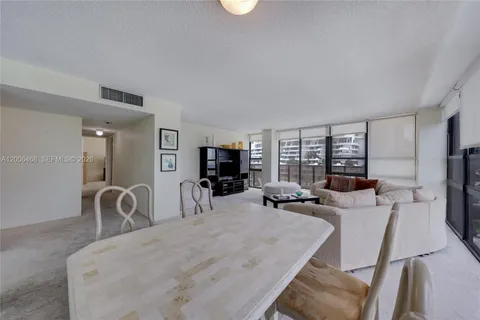 a bedroom with furniture and a flat screen tv