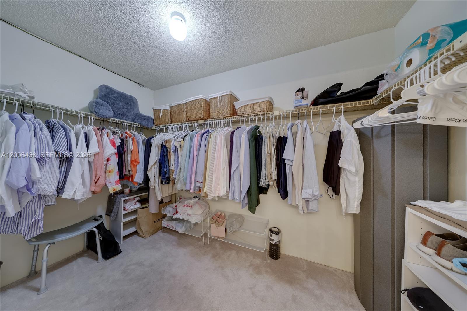600 Northeast 36th Street, Unit 421 Miami, FL 33137 - Photo 10 of 16 a view of walk in closet with clothes