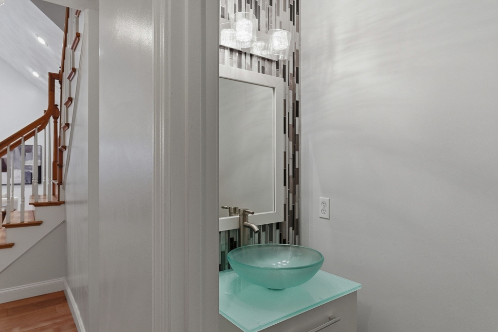 5 Aspen Circle Bedford, MA 01730 - Photo 19 of 28 a bathroom with mirror and sink