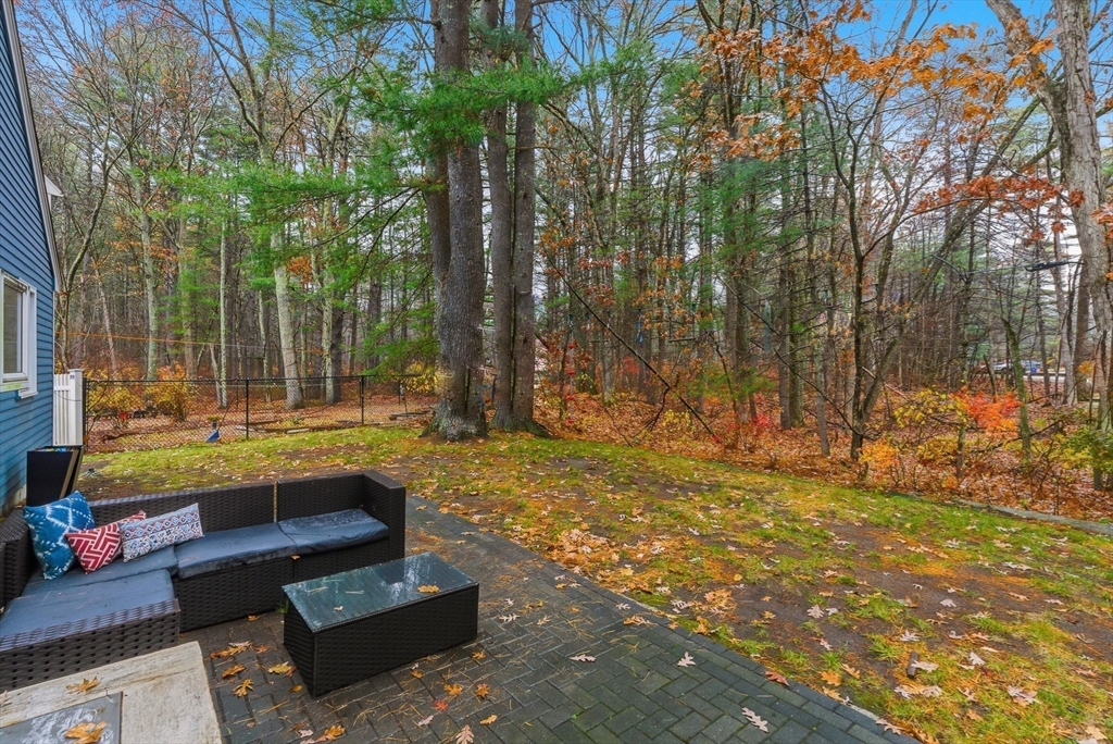 5 Aspen Circle Bedford, MA 01730 - Photo 27 of 28 a swimming pool with outdoor seating and yard