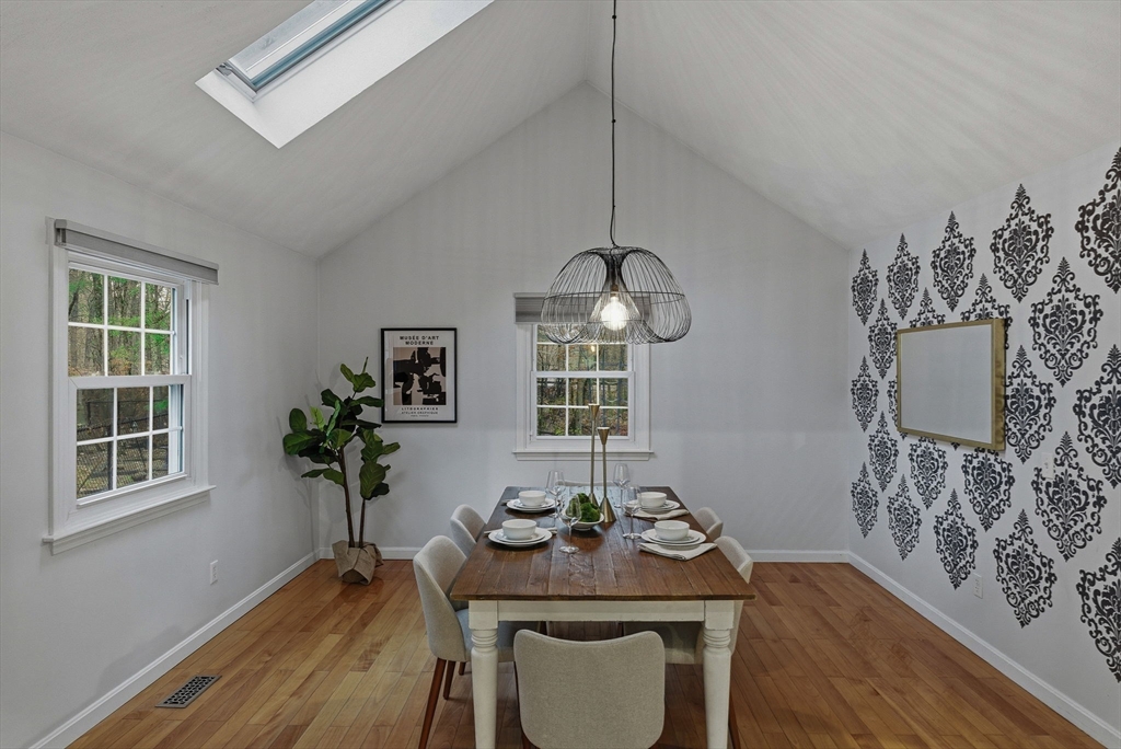 5 Aspen Circle Bedford, MA 01730 - Photo 3 of 28 a view of a dining room with furniture window and wooden floor