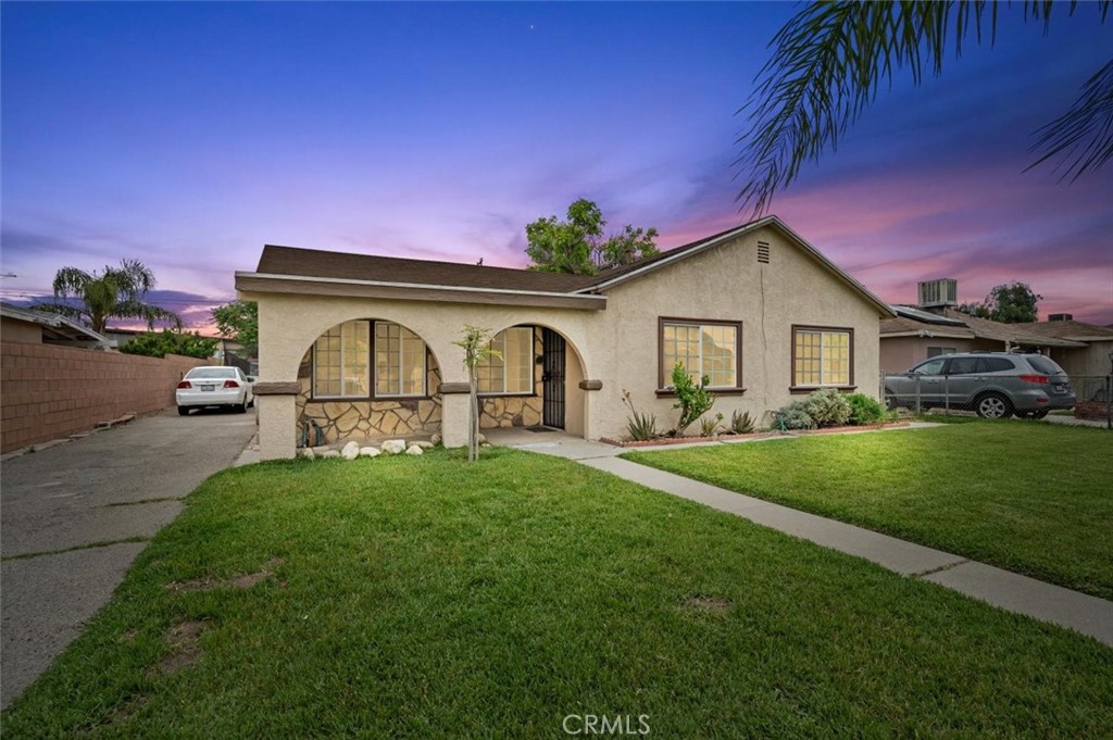 a front view of a house with garden