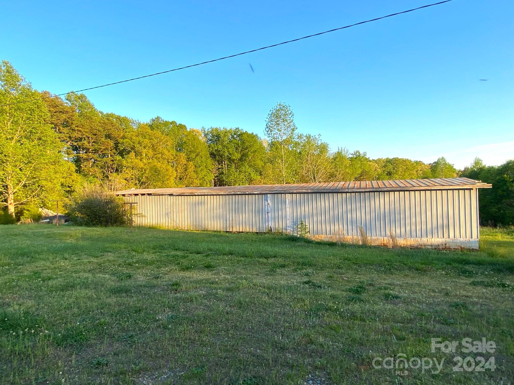 1145 Bess Town Road Bessemer City, NC 28016 - Photo 15 of 15 a view of a yard with a house in the background