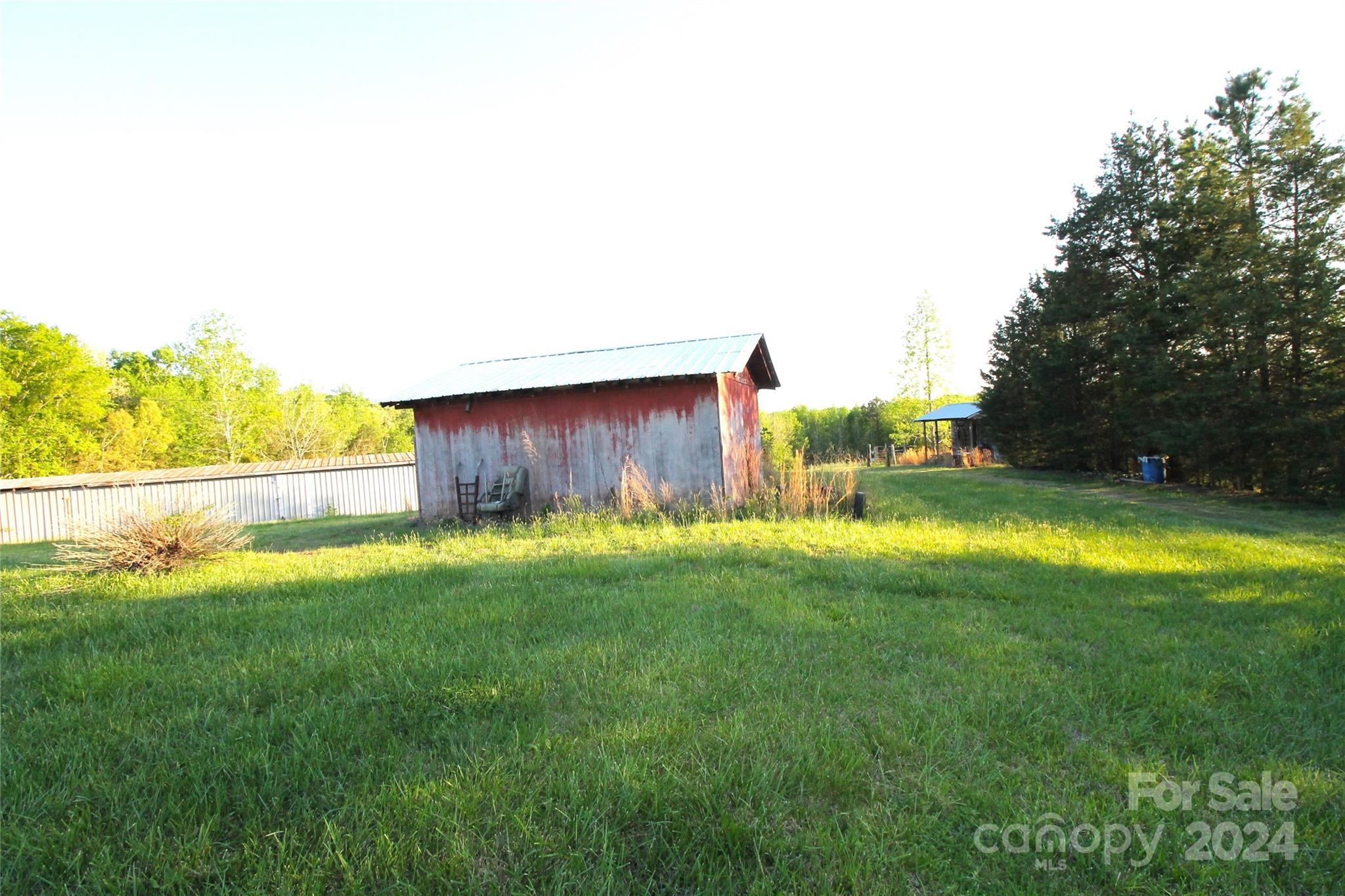 1145 Bess Town Road Bessemer City, NC 28016 - Photo 4 of 15 a view of backyard with swimming pool and outdoor seating