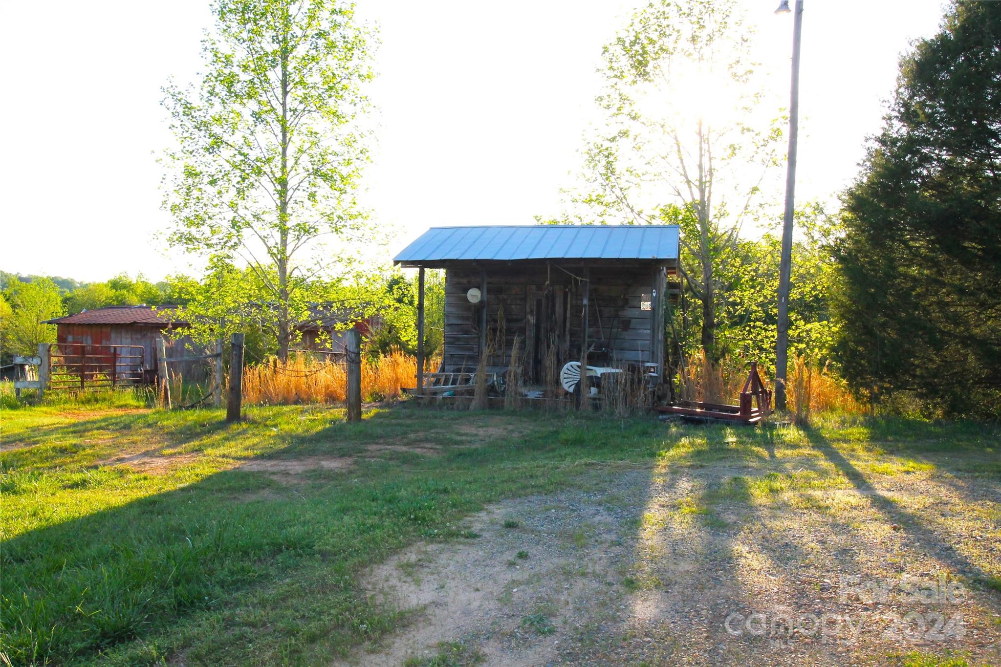 1145 Bess Town Road Bessemer City, NC 28016 - Photo 5 of 15 a view of a backyard with a garden and plants