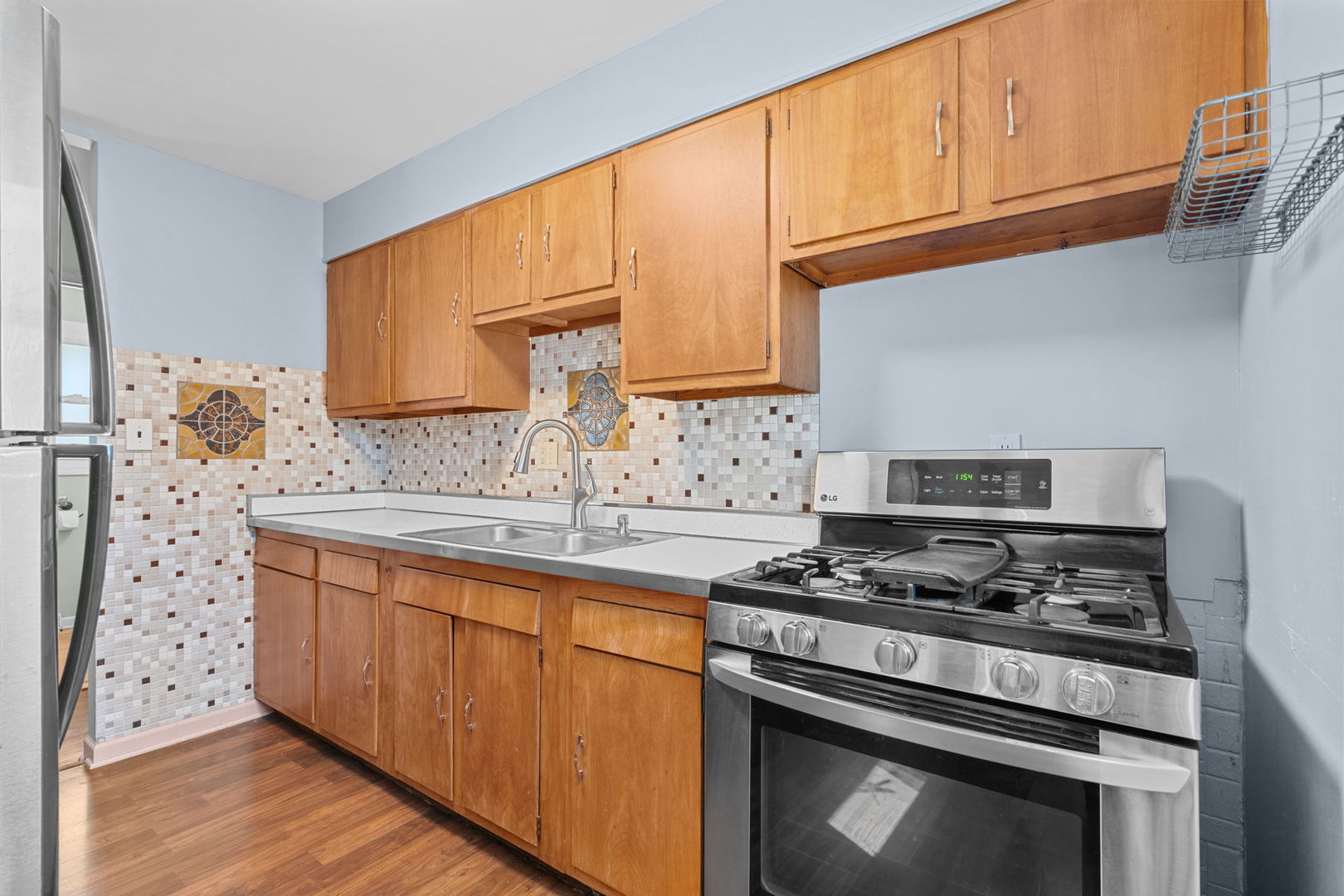 8911 Ramble Road Wonder Lake, IL 60097 - Photo 2 of 36 a kitchen with granite countertop a sink stove and cabinets