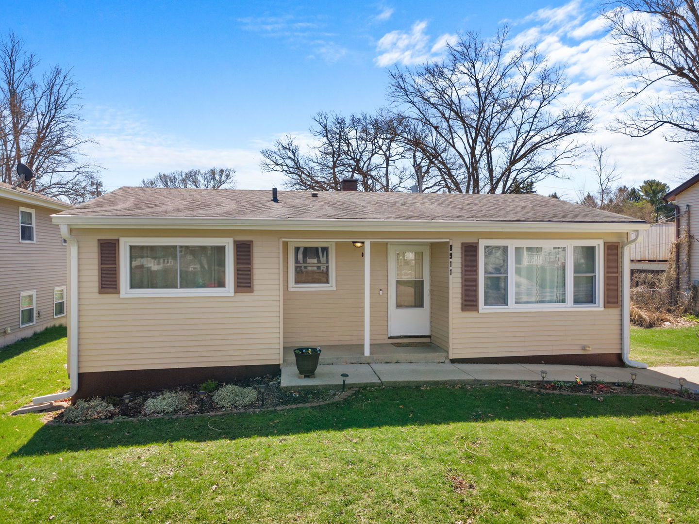 8911 Ramble Road Wonder Lake, IL 60097 - Photo 21 of 36 a front view of a house with a yard