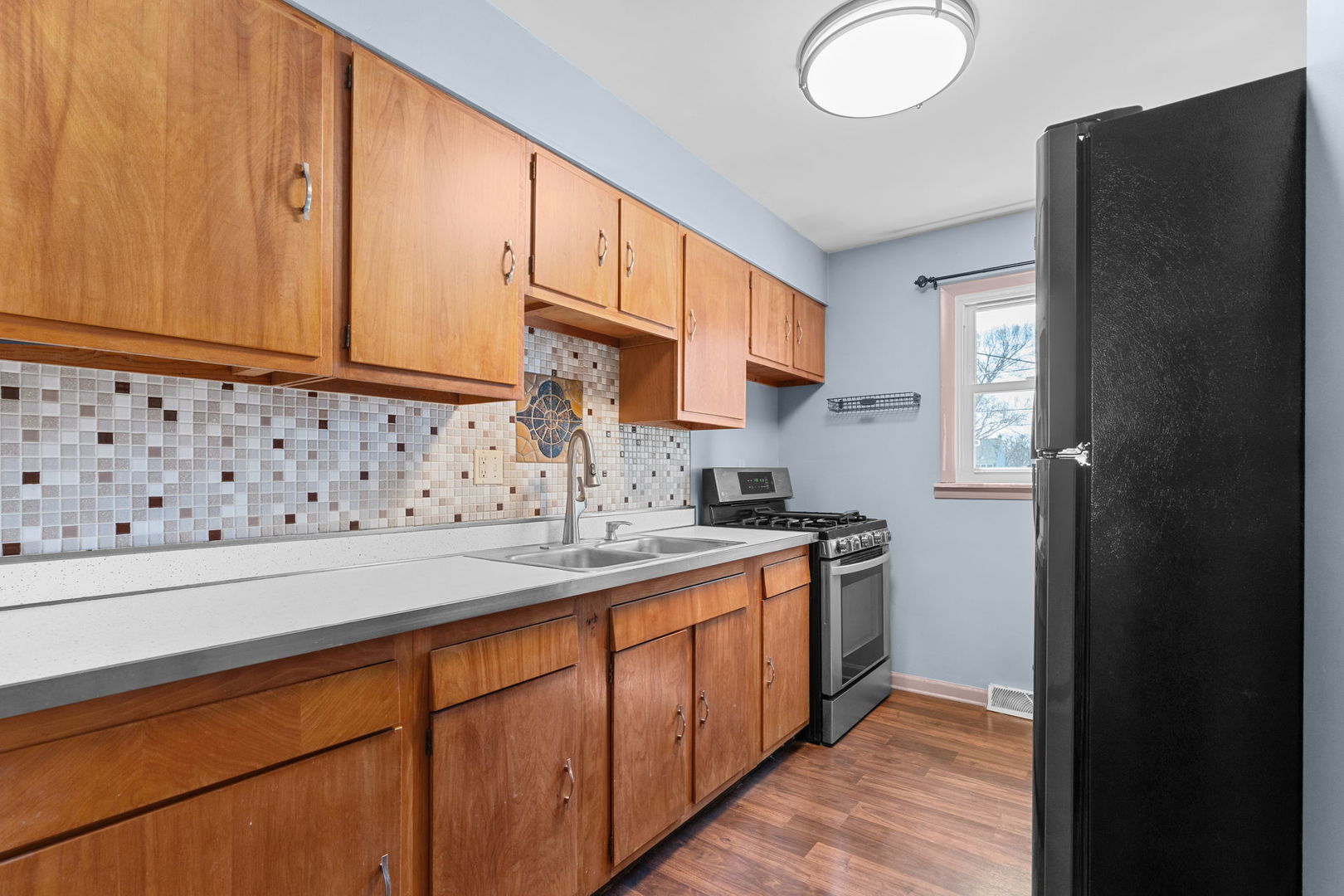8911 Ramble Road Wonder Lake, IL 60097 - Photo 3 of 36 a kitchen with stainless steel appliances granite countertop a sink stove and cabinets