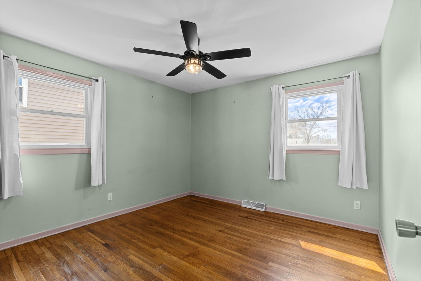 8911 Ramble Road Wonder Lake, IL 60097 - Photo 8 of 36 a view of empty room with wooden floor and fan