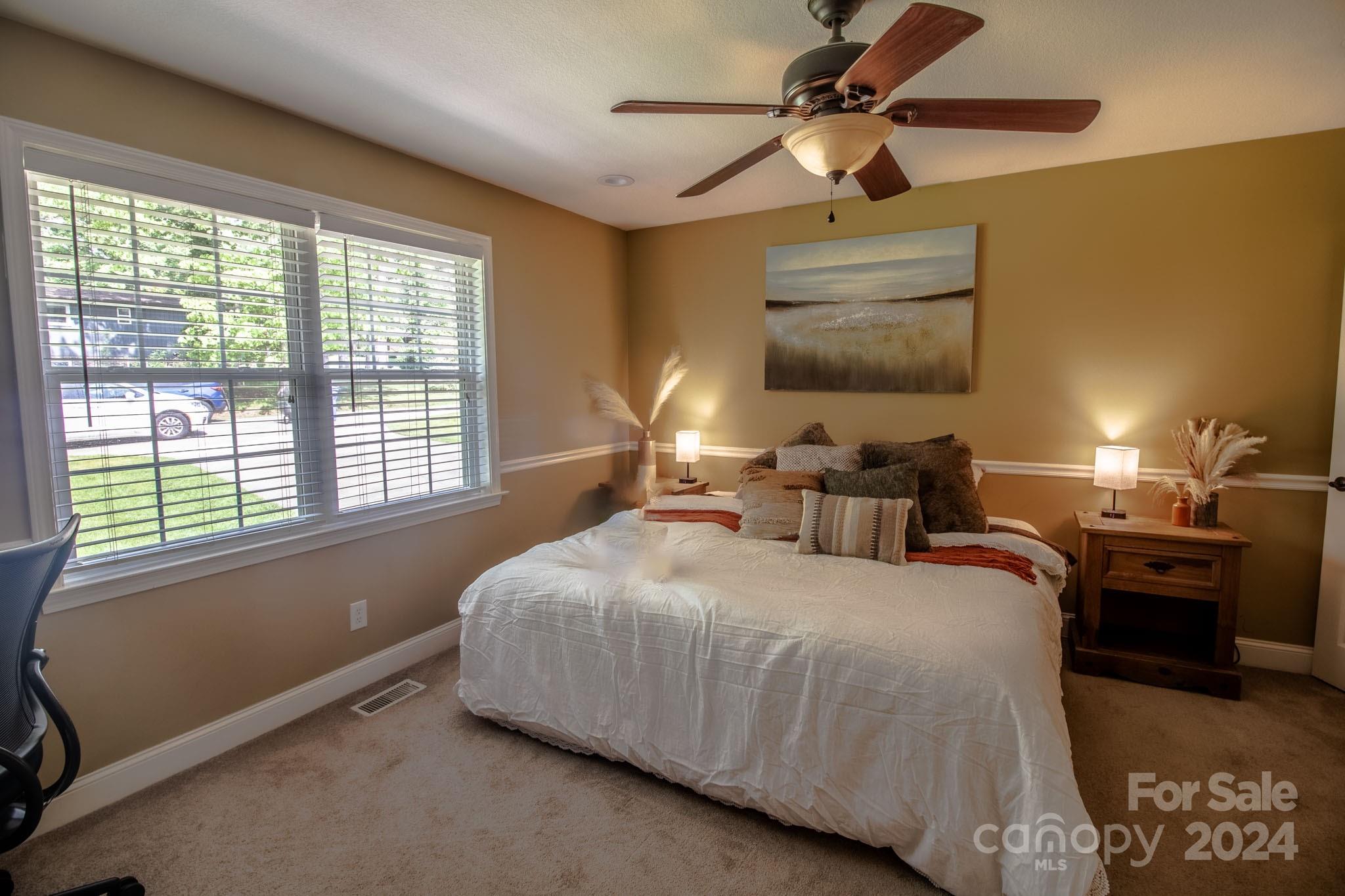 21 Norman Road Fletcher, NC 28732 - Photo 11 of 21 a bedroom with a bed and window