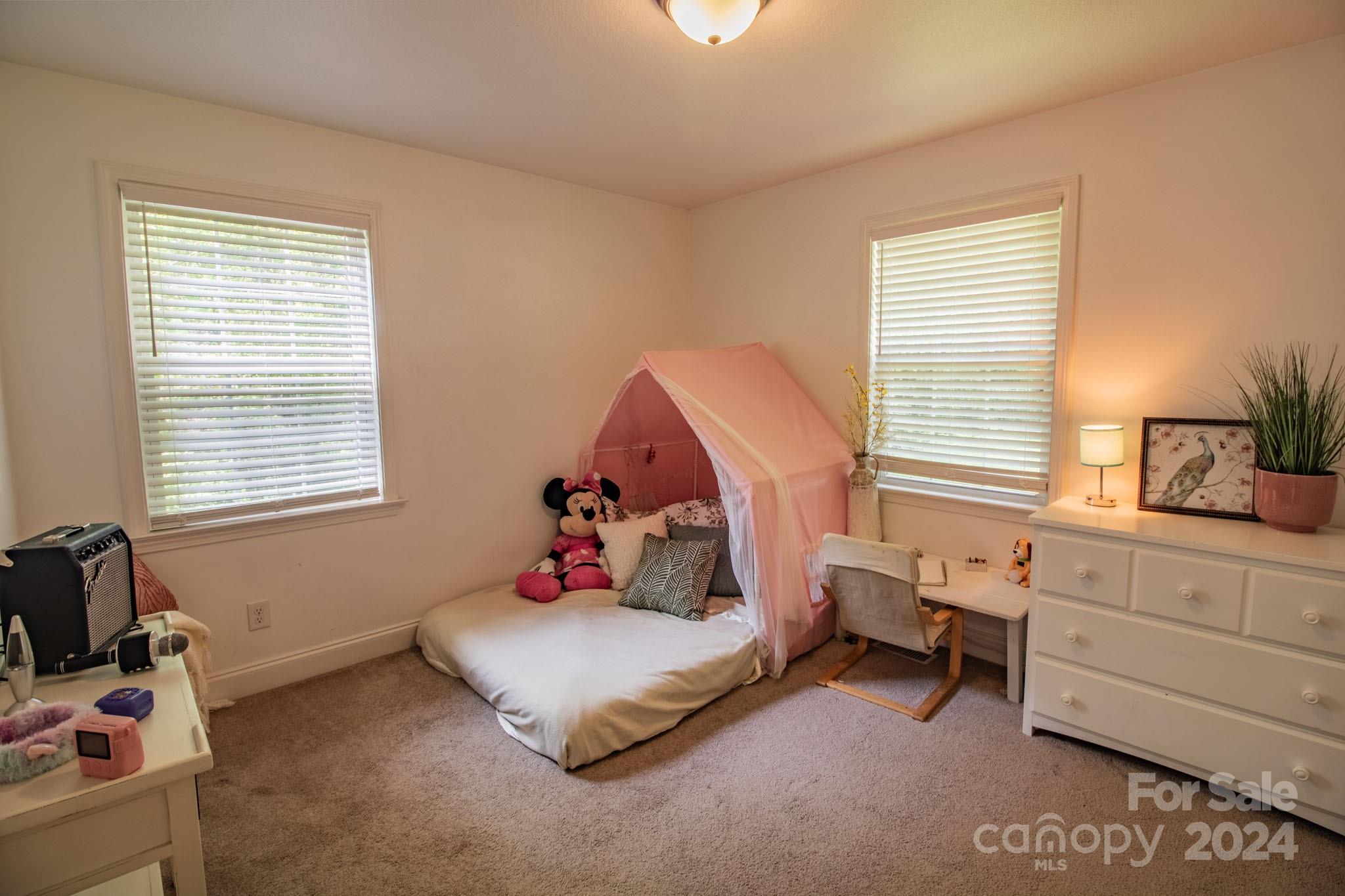 21 Norman Road Fletcher, NC 28732 - Photo 13 of 21 a bedroom with a bed and a window