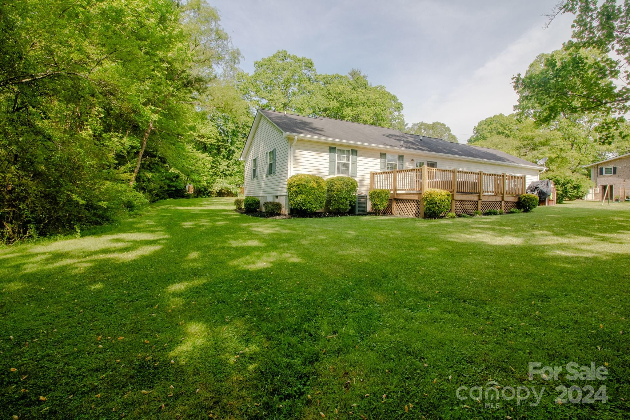 21 Norman Road Fletcher, NC 28732 - Photo 17 of 21 a view of a house with a big yard and large trees