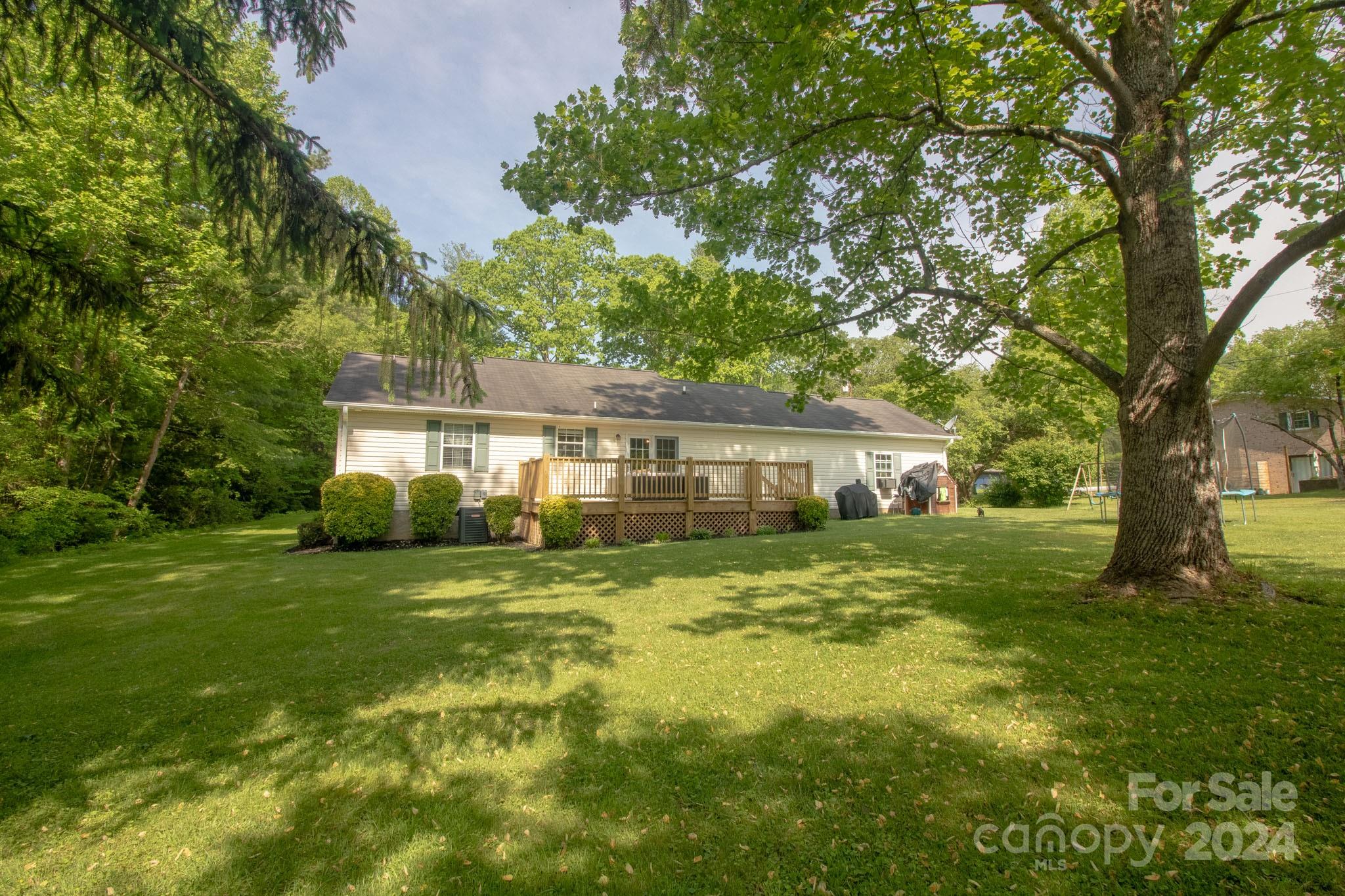 21 Norman Road Fletcher, NC 28732 - Photo 18 of 21 a front view of a house with a garden