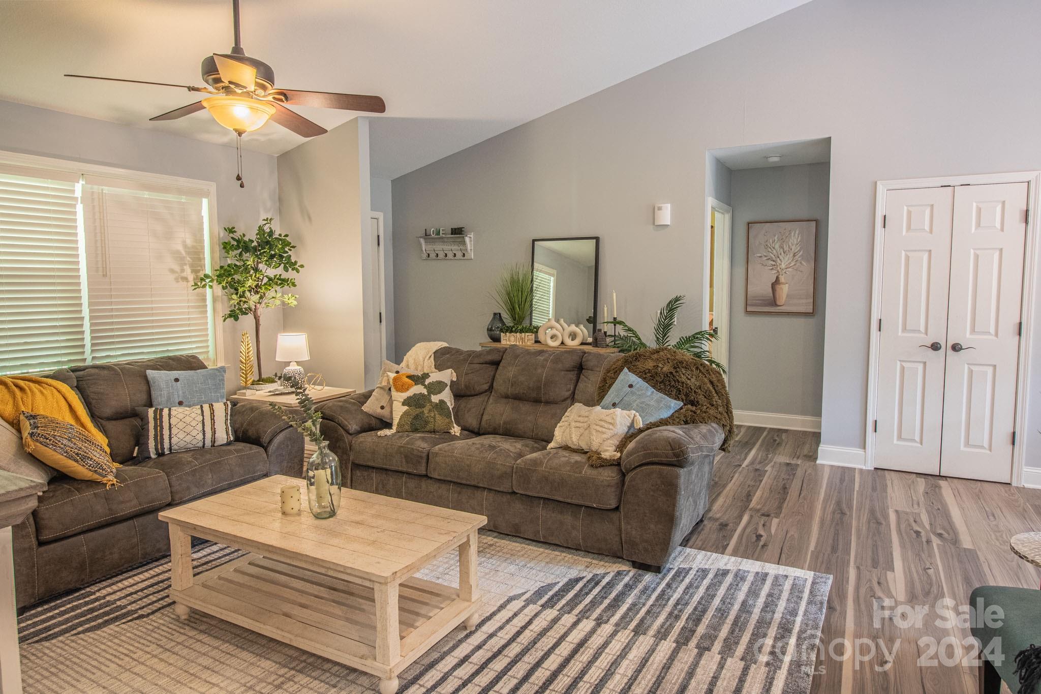 21 Norman Road Fletcher, NC 28732 - Photo 7 of 21 a living room with furniture and a chandelier