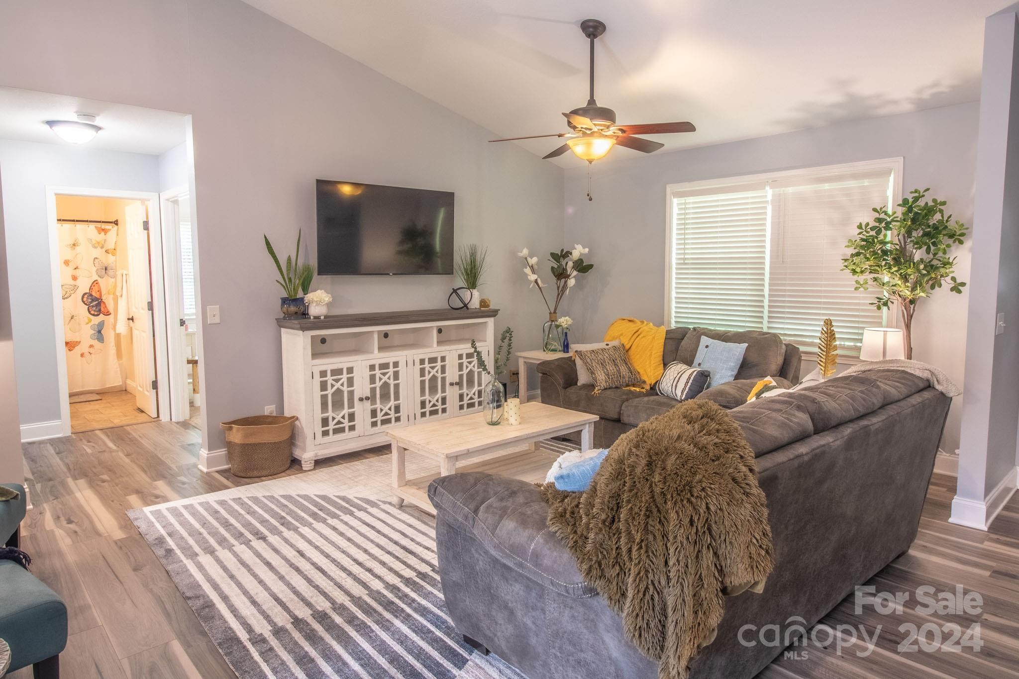 21 Norman Road Fletcher, NC 28732 - Photo 8 of 21 a living room with furniture and a flat screen tv
