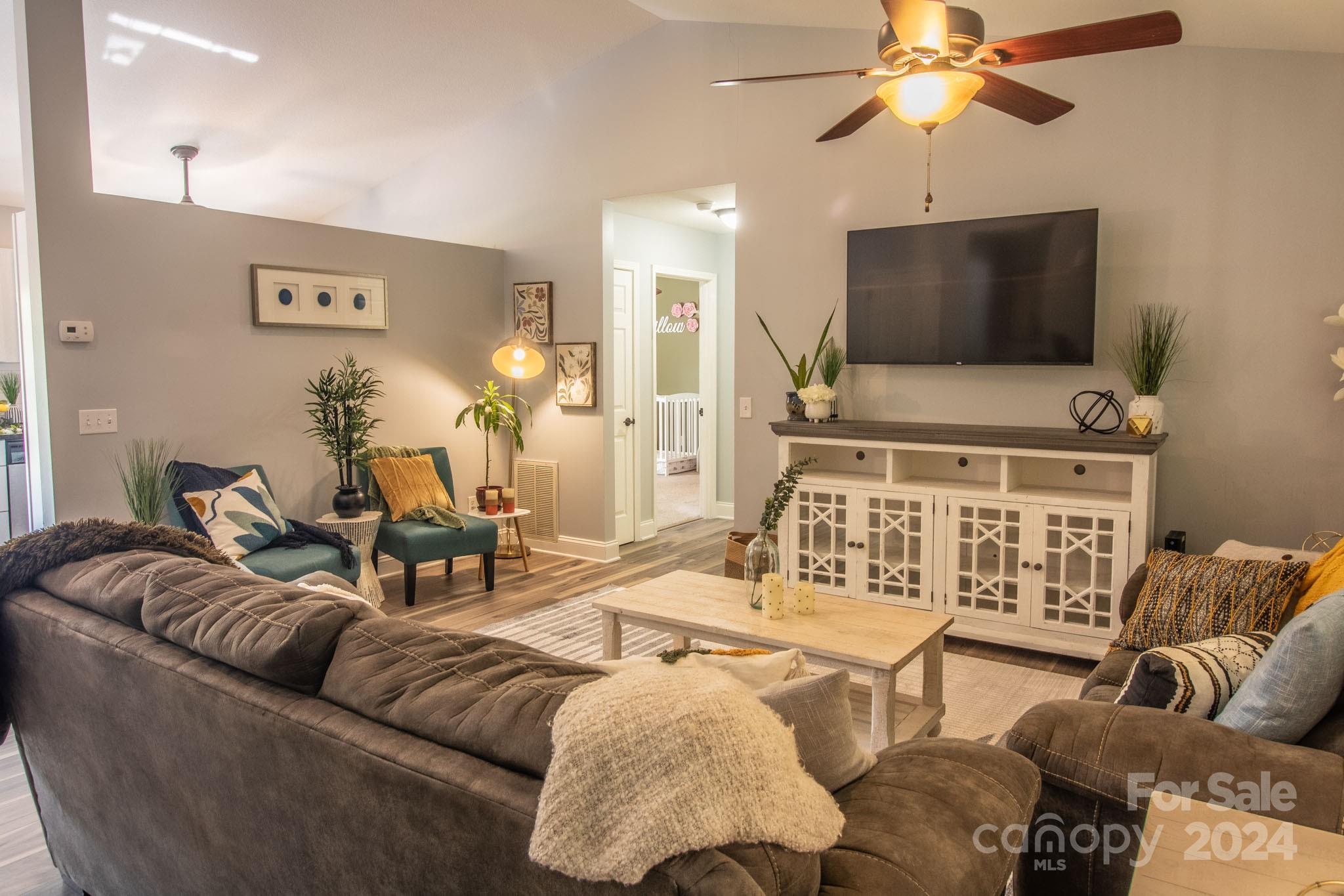 21 Norman Road Fletcher, NC 28732 - Photo 9 of 21 a living room with furniture and a flat screen tv