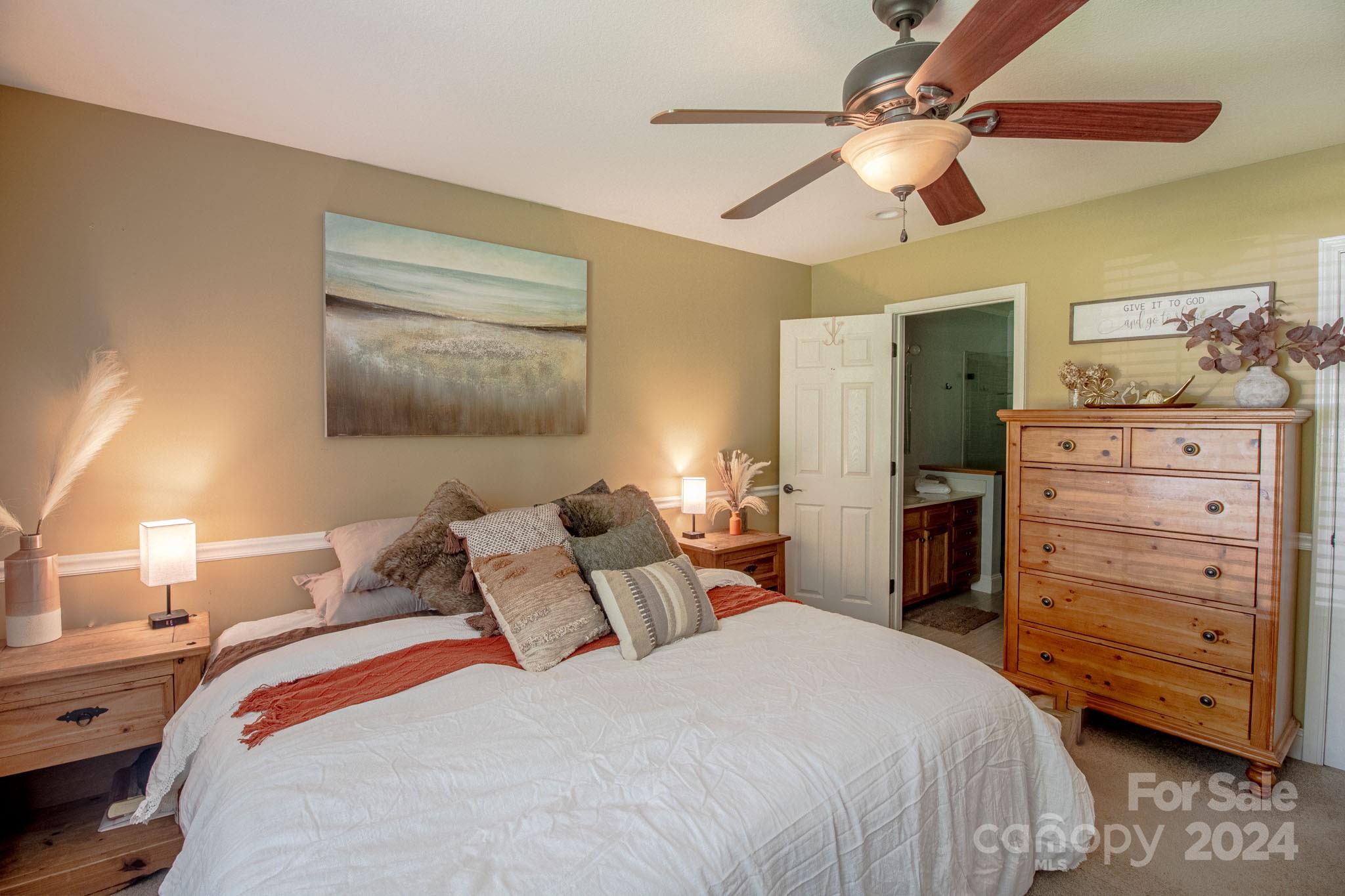 21 Norman Road Fletcher, NC 28732 - Photo 10 of 21 a bedroom with a bed and ceiling fan