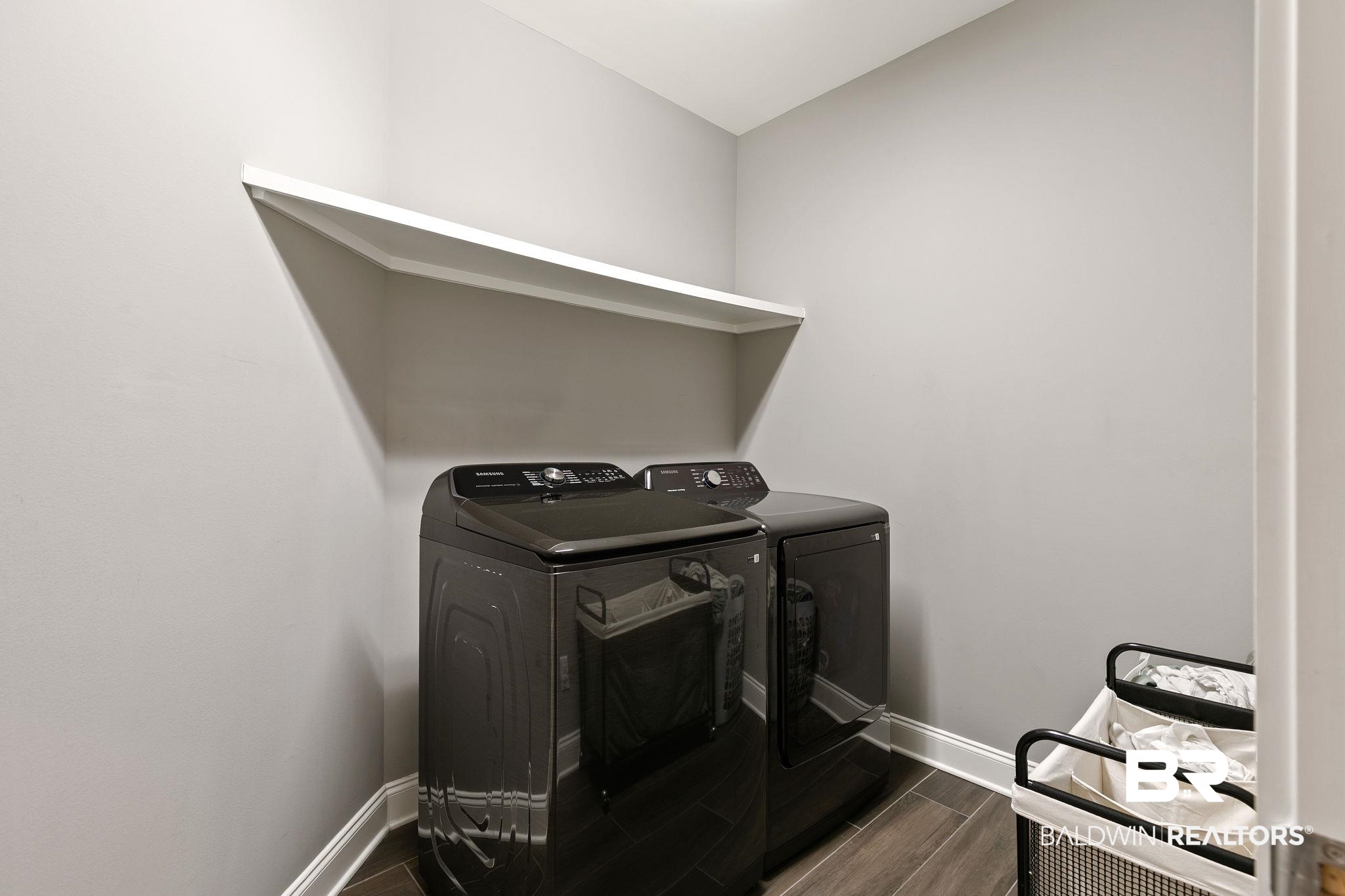 31911 Bobwhite Road Daphne, AL 36527 - Photo 46 of 85 Laundry area with wood finish floors and washing machine and clothes dryer