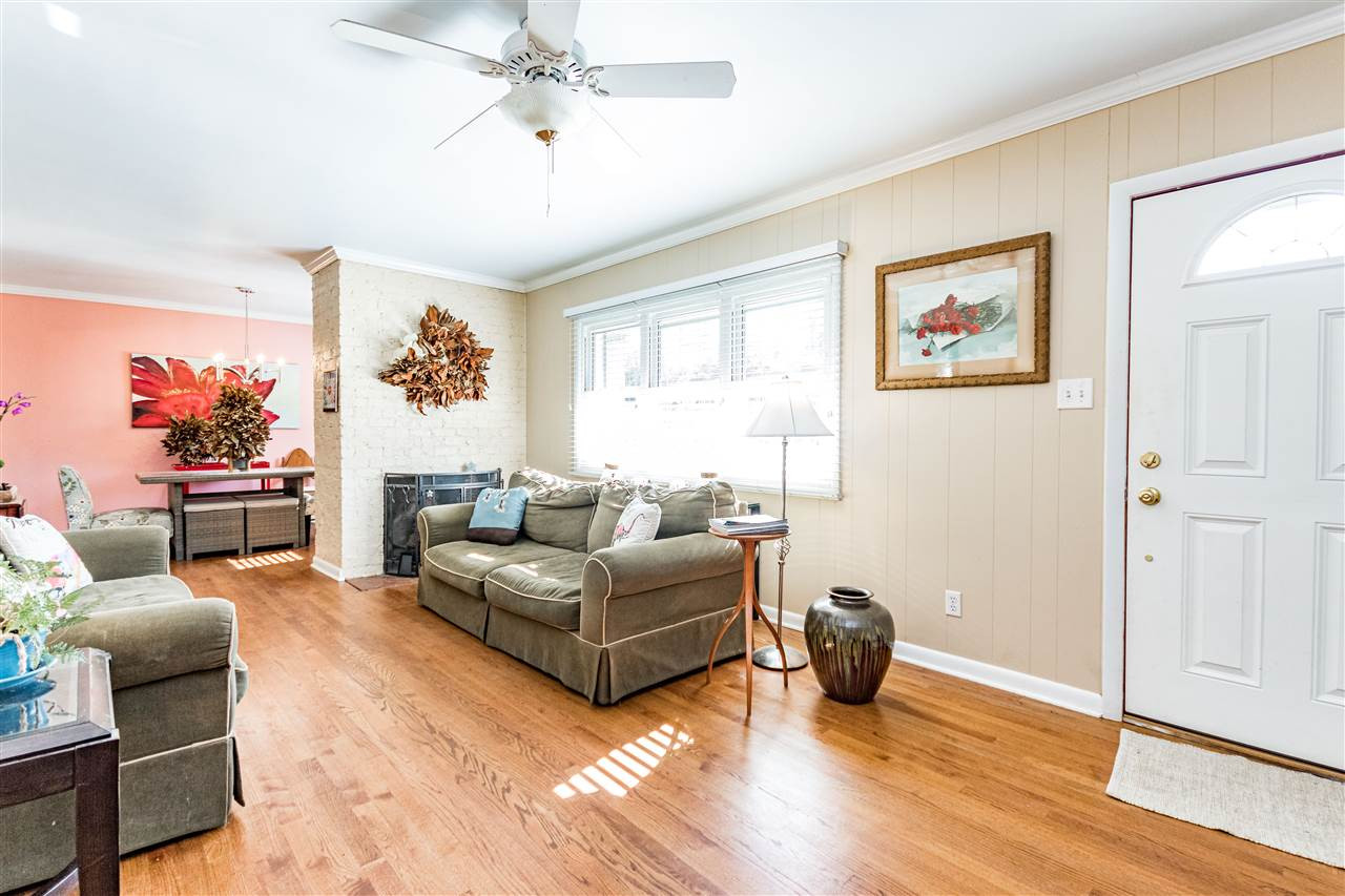 2332 Airline Drive Raleigh, NC 27607 - Photo 3 of 23 Fireplace besie the sofa. Big open windows! Living Room