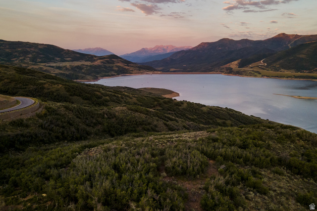 9269 North Sunset Road Kamas, UT 84036 - Photo 11 of 21 Expansive landscape featuring a large body of water, rolling hills, distant mountains, and winding roadways
