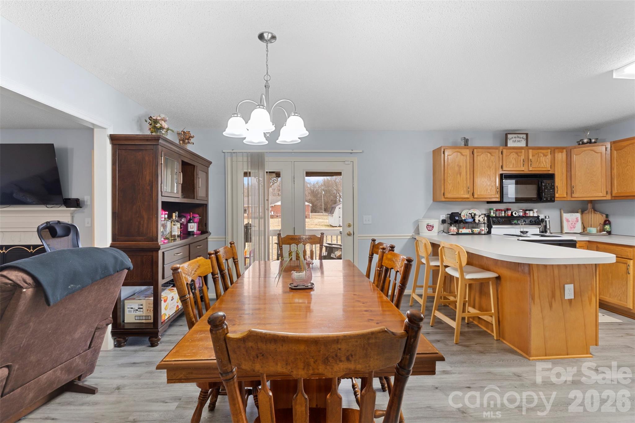 155 Sundial Street Lexington, NC 27295 - Photo 15 of 38 a view of kitchen with sink dining table and chairs