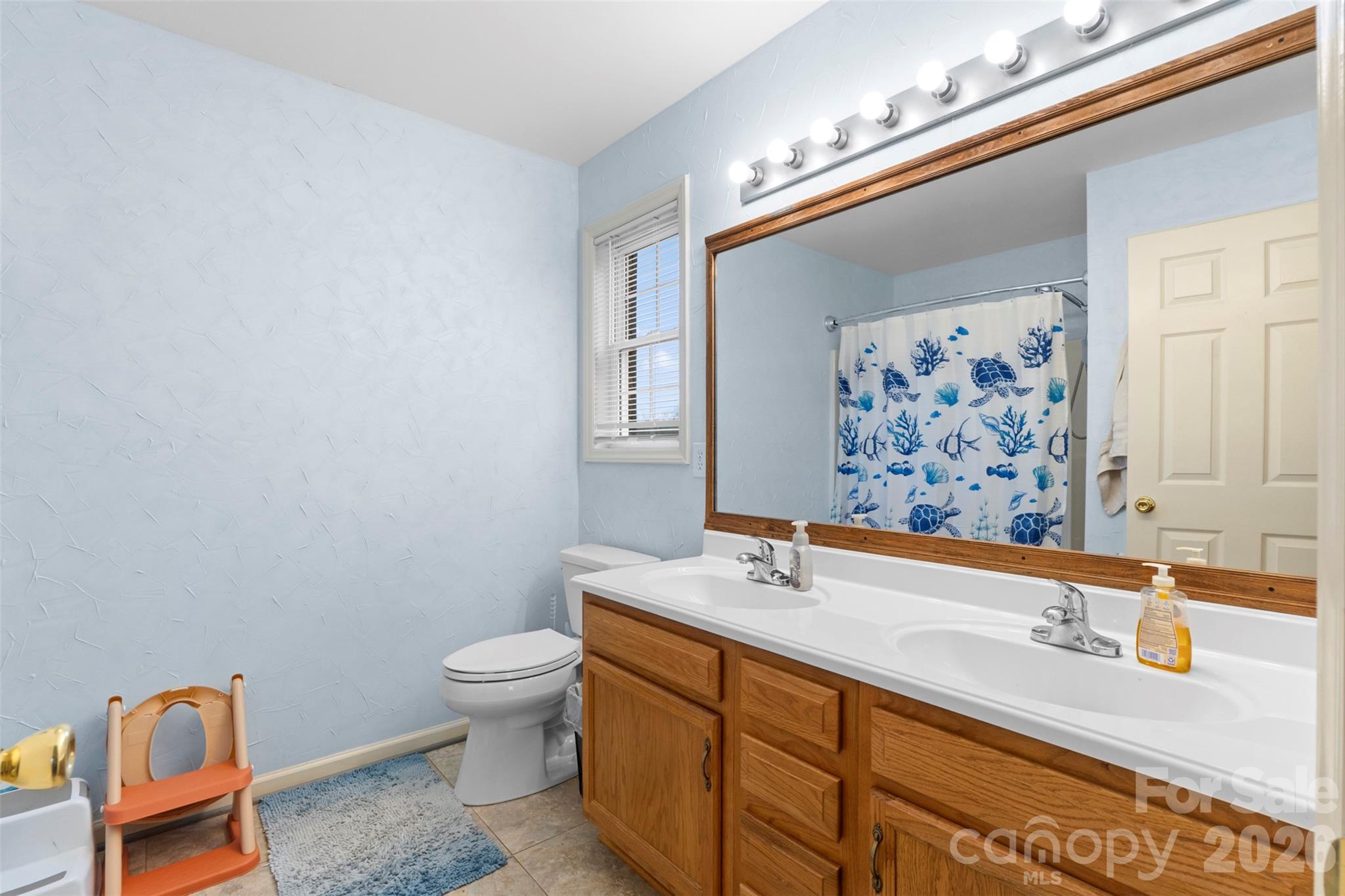 155 Sundial Street Lexington, NC 27295 - Photo 21 of 38 a bathroom with a sink a toilet and shower