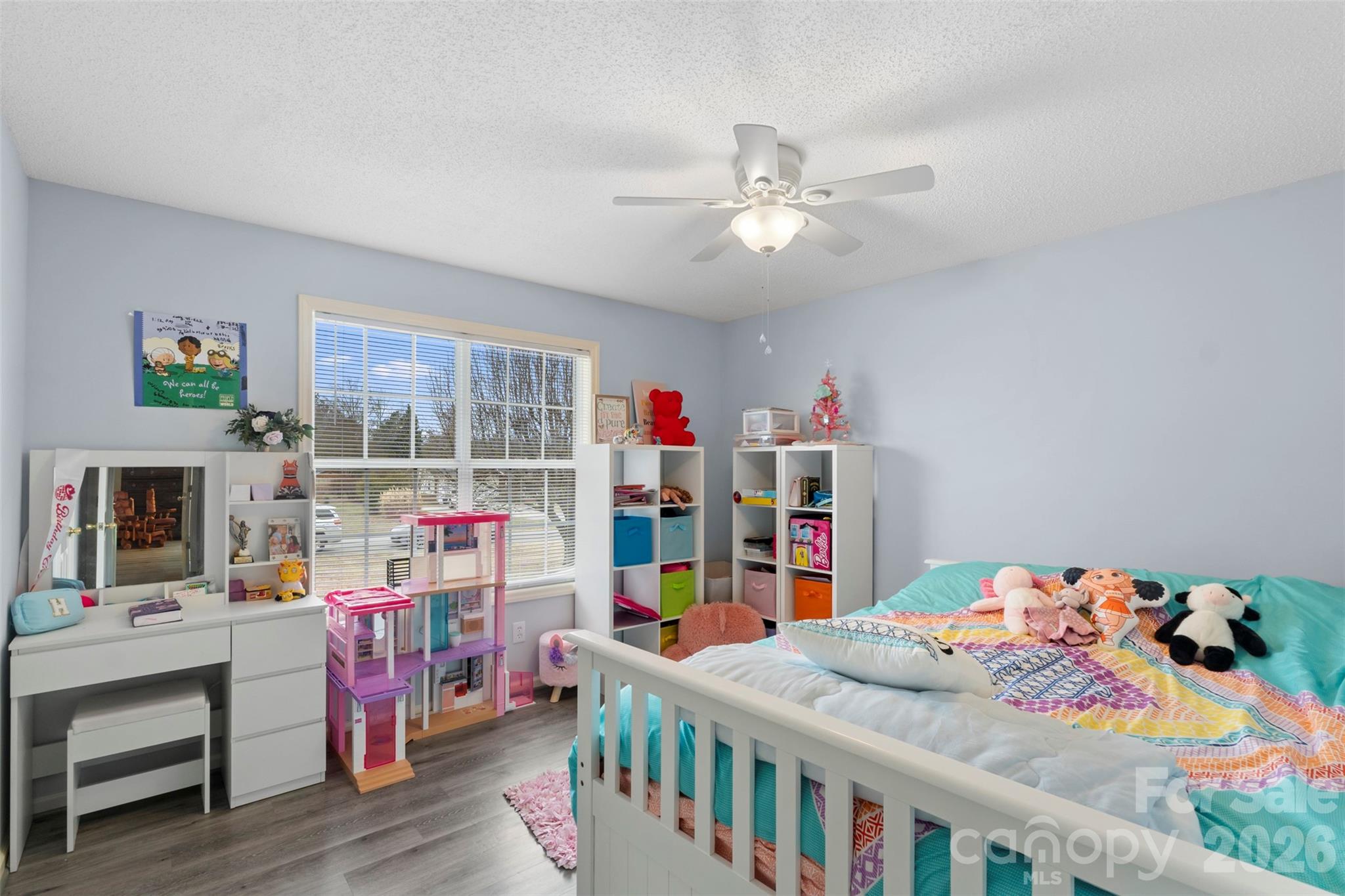 155 Sundial Street Lexington, NC 27295 - Photo 22 of 38 a bedroom with furniture a baby crib and a chandelier