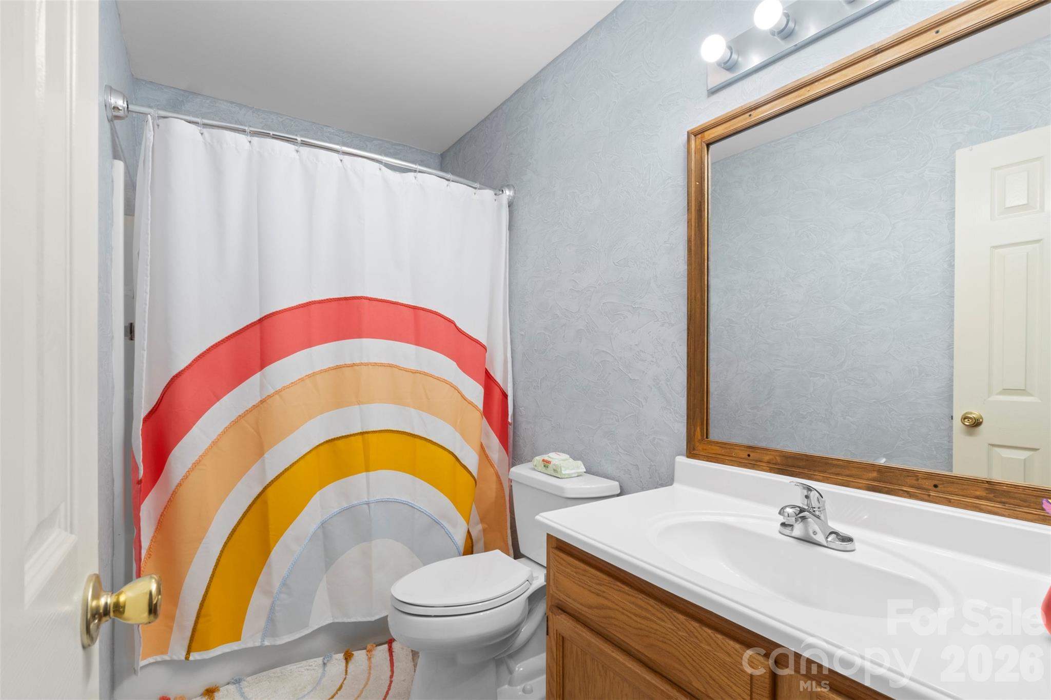 155 Sundial Street Lexington, NC 27295 - Photo 23 of 38 a bathroom with a sink and a mirror