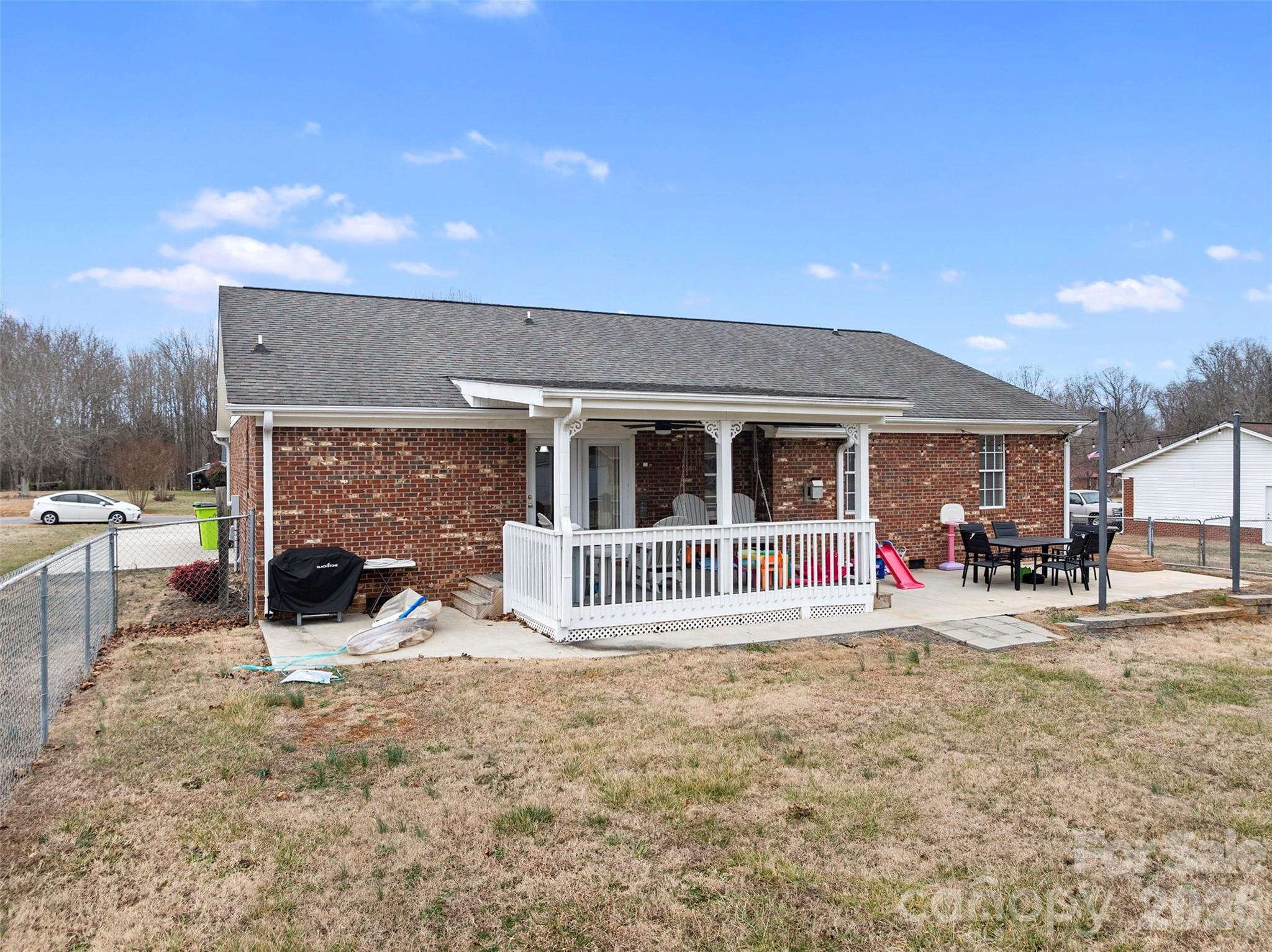 155 Sundial Street Lexington, NC 27295 - Photo 25 of 38 a view of a house with a patio and a yard