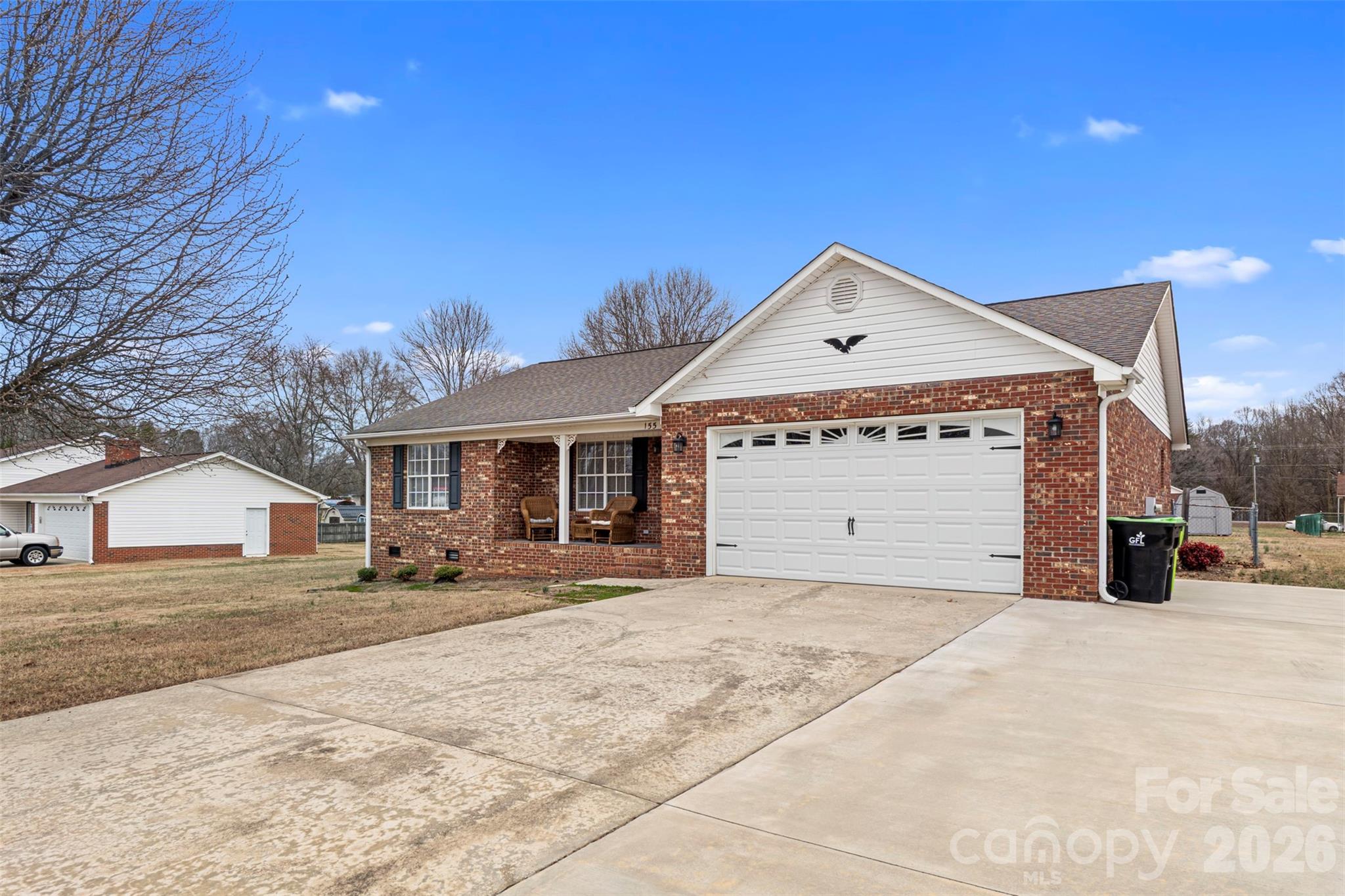 155 Sundial Street Lexington, NC 27295 - Photo 5 of 38 a front view of a house with a yard and garage
