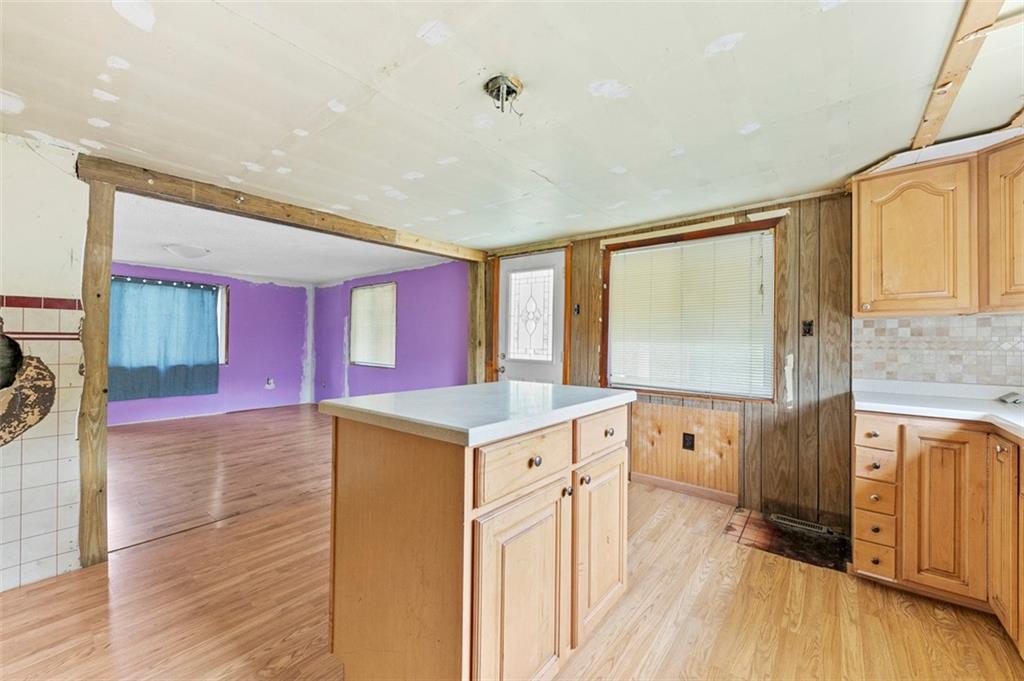 878 Bolden Road Smock, PA 15480 - Photo 14 of 23 a kitchen with a stove a sink and a refrigerator