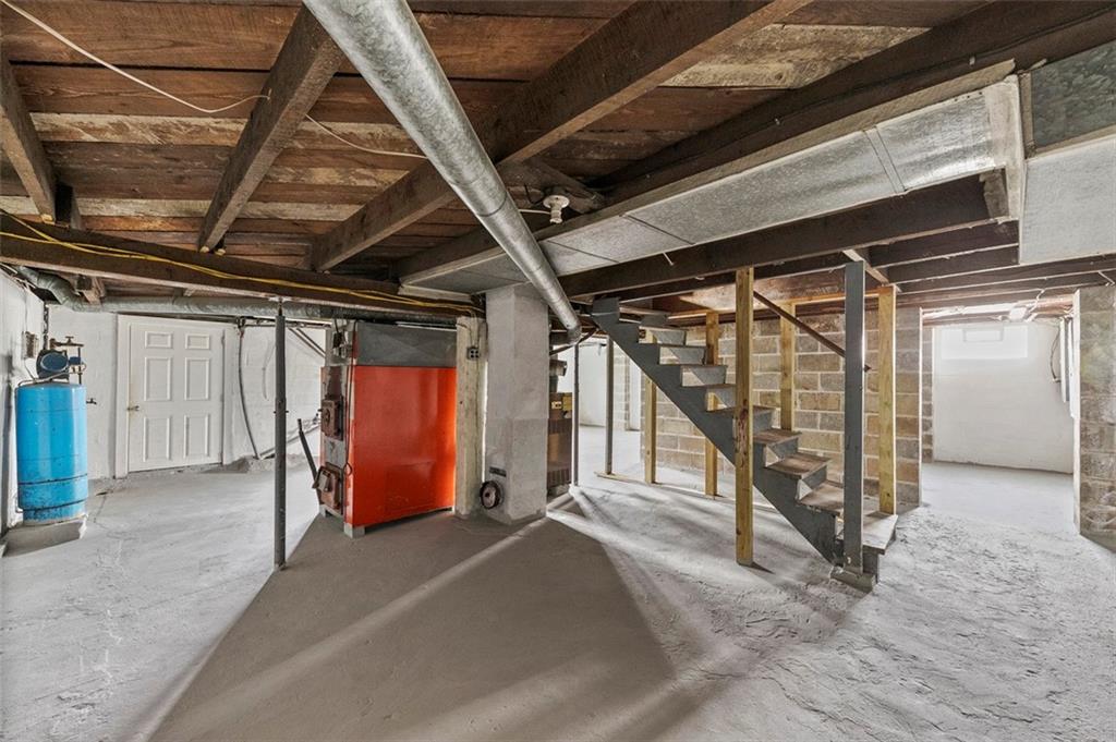 878 Bolden Road Smock, PA 15480 - Photo 22 of 23 a view of an empty room with wooden floor