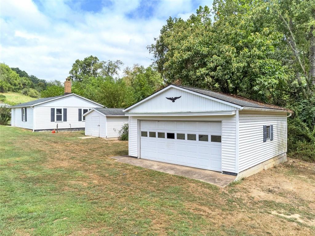 878 Bolden Road Smock, PA 15480 - Photo 5 of 23 a view of a house with a yard