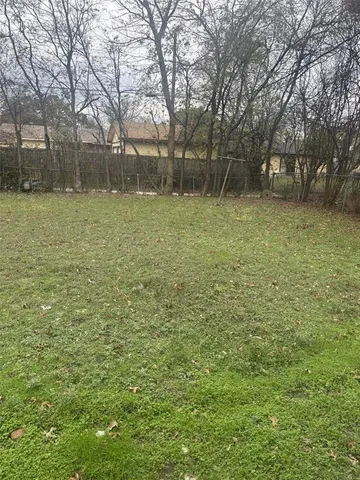 a backyard of a house with lots of green space and garden view