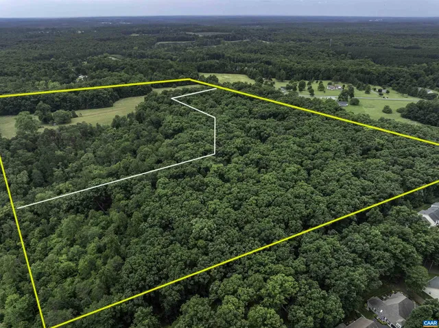 a view of a balcony with a yard