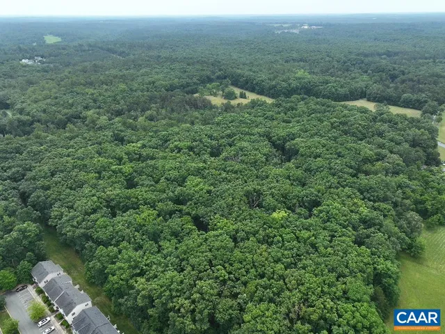 a view of a field with an ocean view