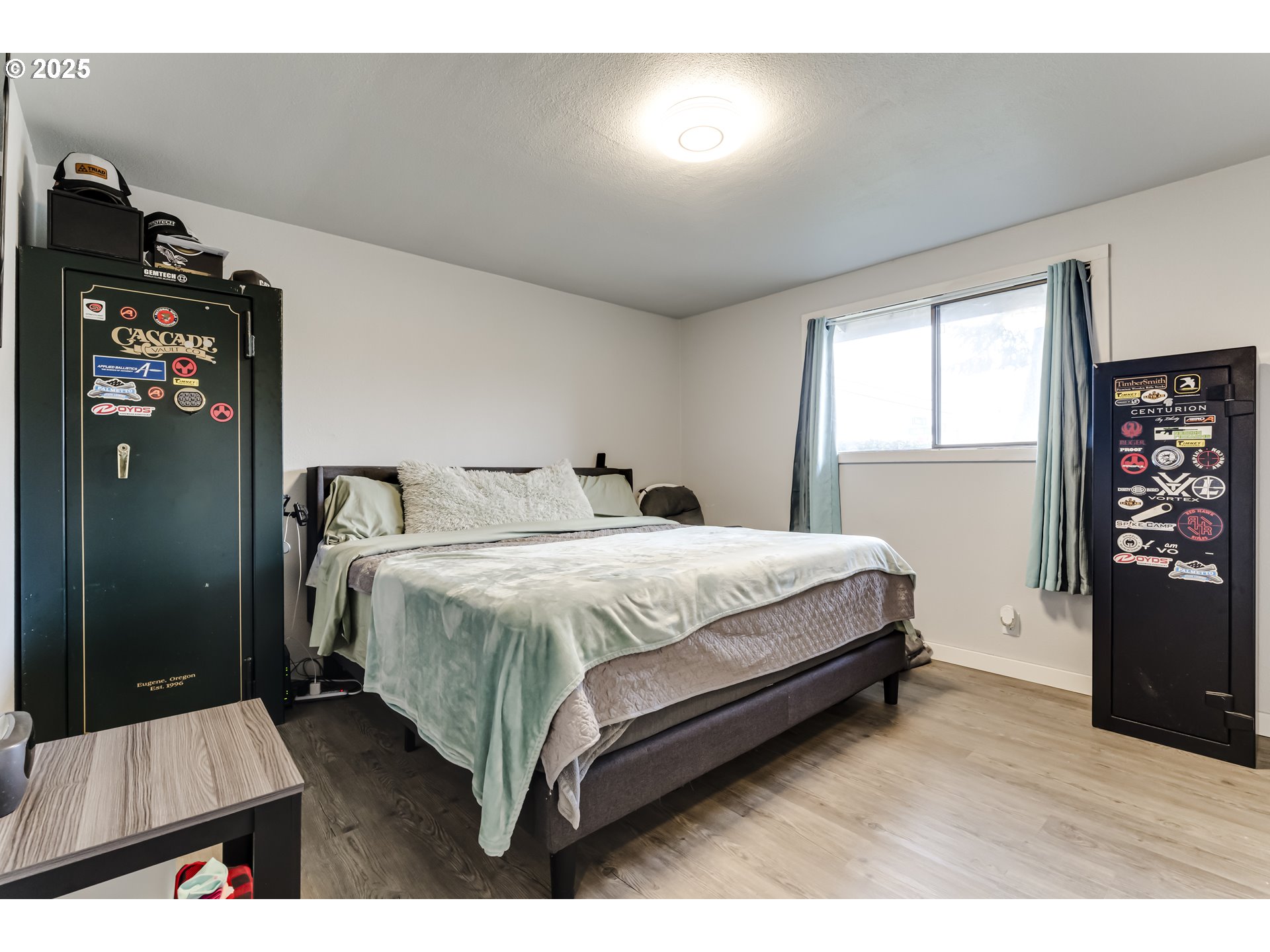 6865 Main Street Springfield, OR 97478 - Photo 15 of 48 a bedroom with a bed and a dresser