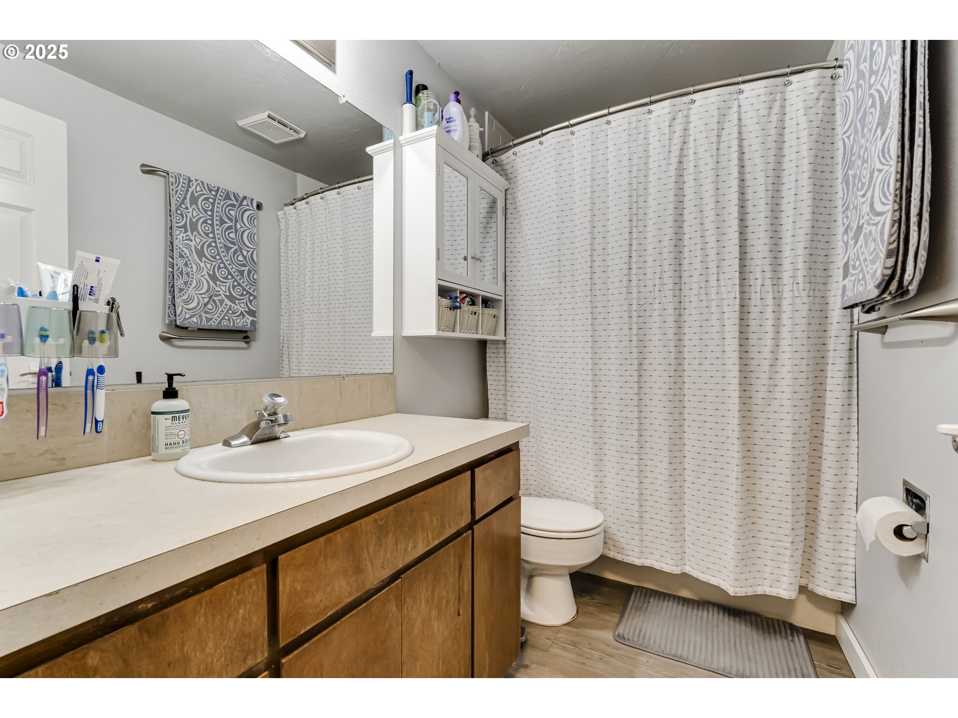 6865 Main Street Springfield, OR 97478 - Photo 19 of 48 a bathroom with a sink toilet and shower