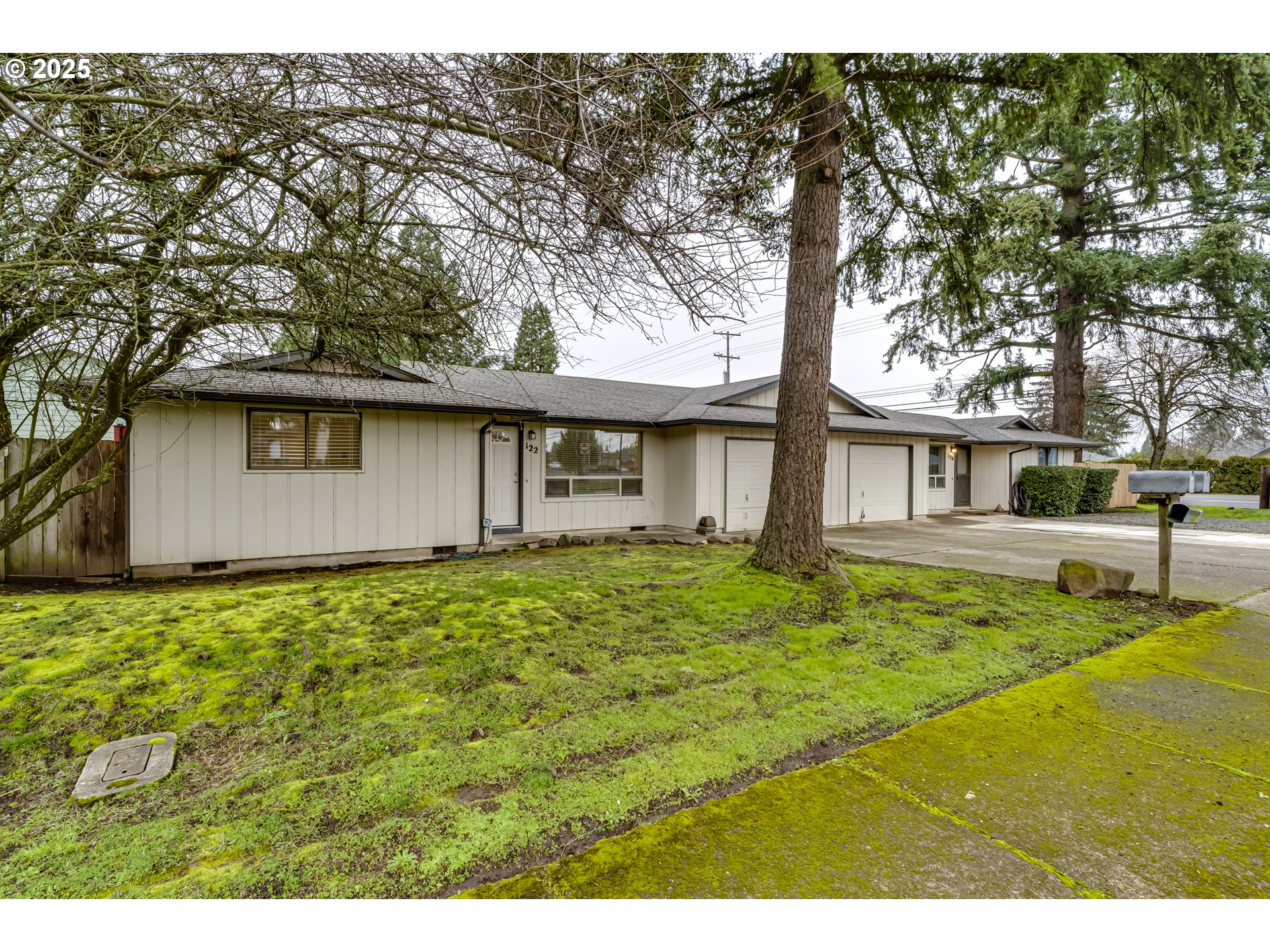 6865 Main Street Springfield, OR 97478 - Photo 25 of 48 a front view of a house with garden
