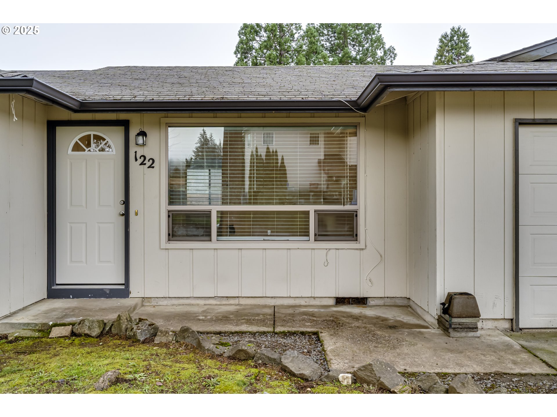 6865 Main Street Springfield, OR 97478 - Photo 26 of 48 a front view of a house with a yard