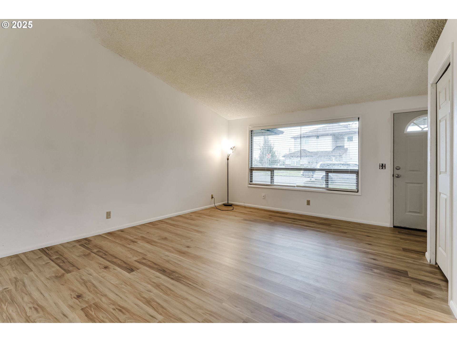 6865 Main Street Springfield, OR 97478 - Photo 27 of 48 an empty room with wooden floor and windows