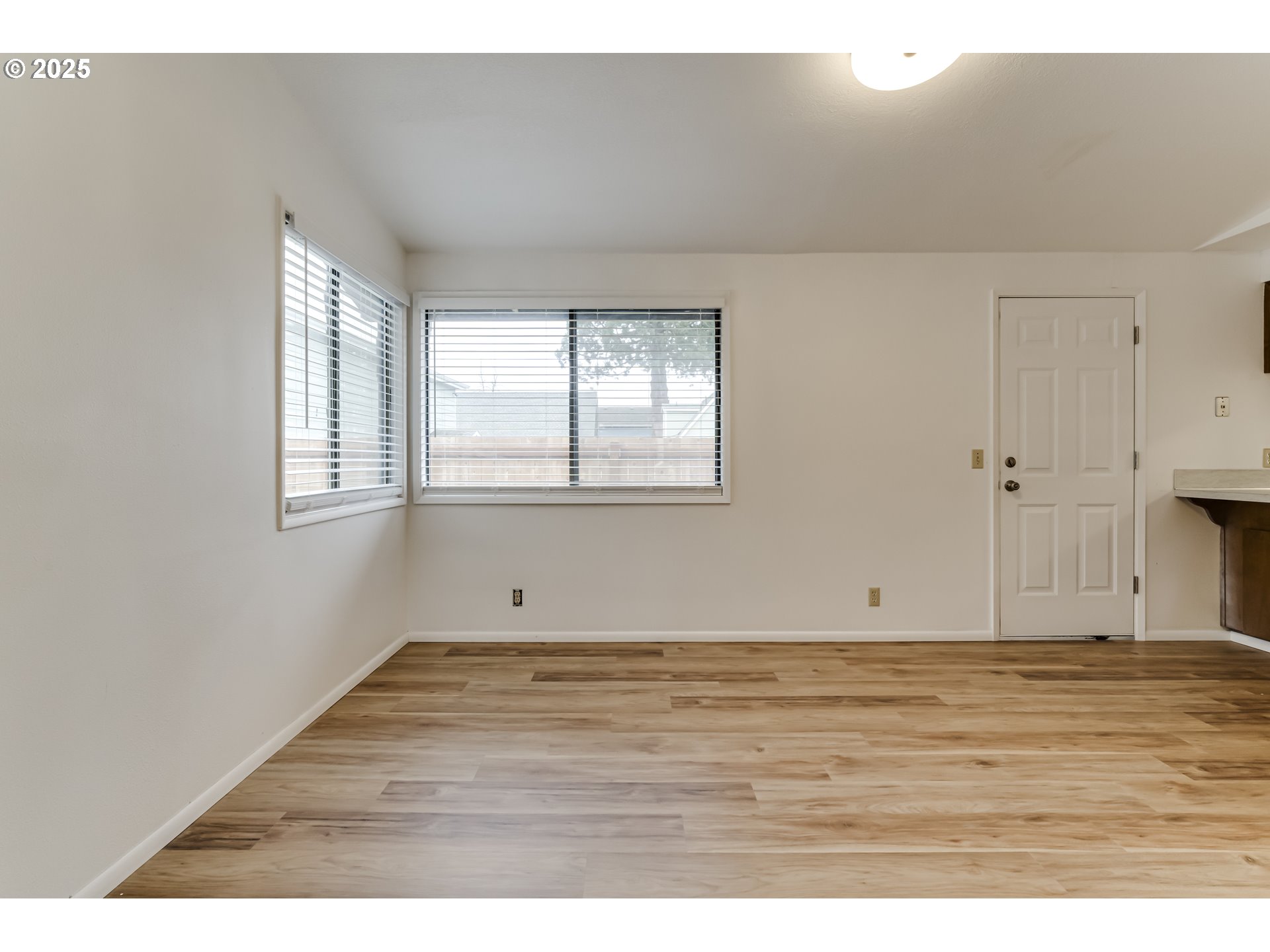 6865 Main Street Springfield, OR 97478 - Photo 30 of 48 a view of an empty room with wooden floor and a window