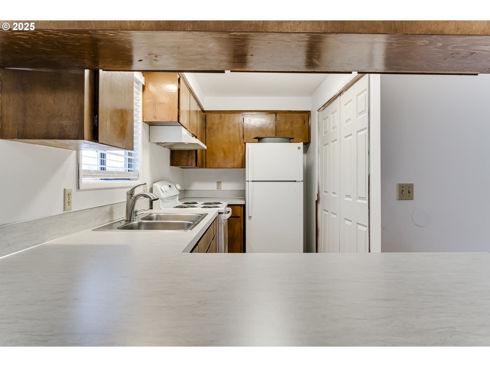 6865 Main Street Springfield, OR 97478 - Photo 33 of 48 a kitchen with a refrigerator and a sink