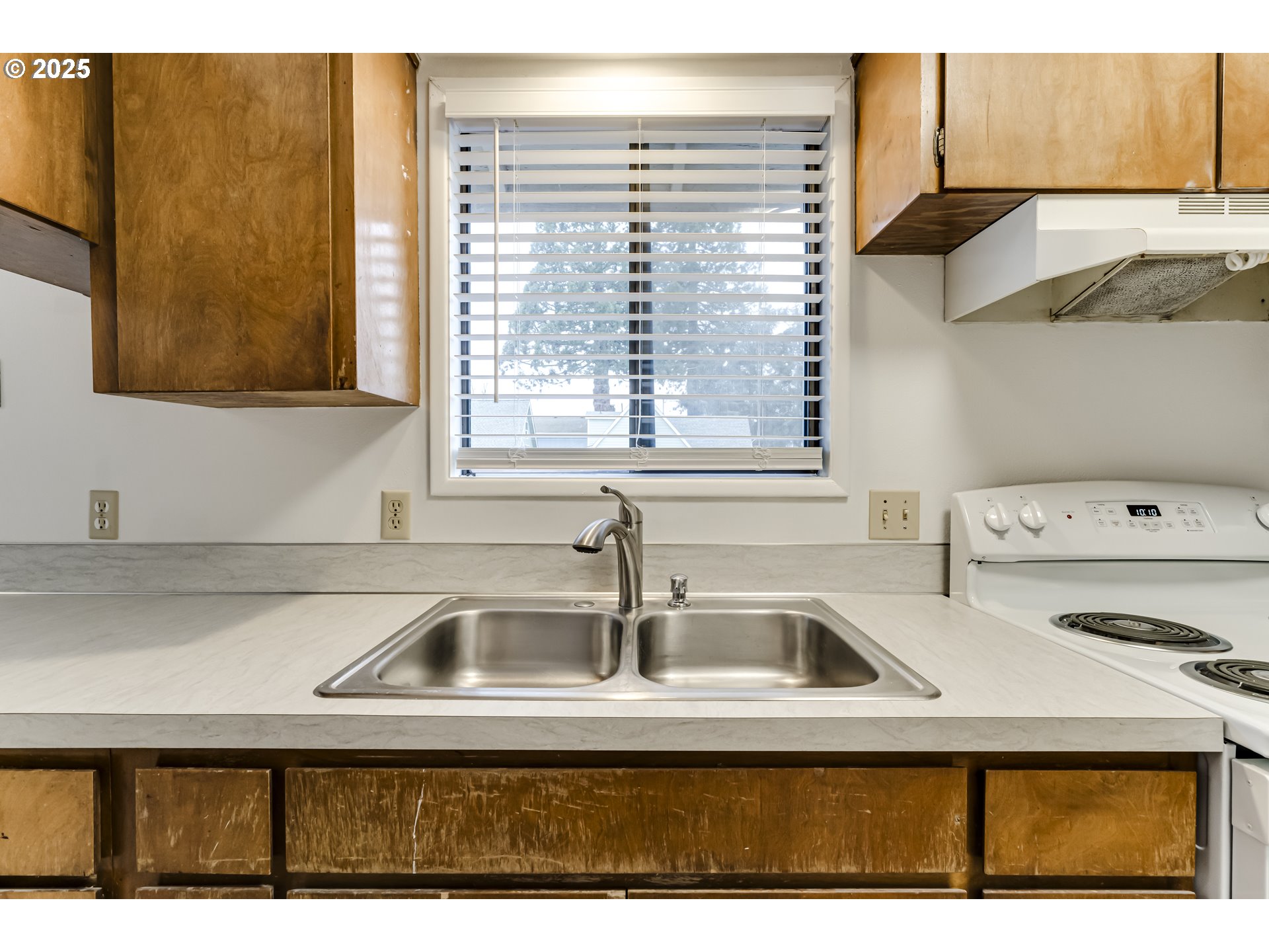 6865 Main Street Springfield, OR 97478 - Photo 35 of 48 a kitchen with a sink and cabinets