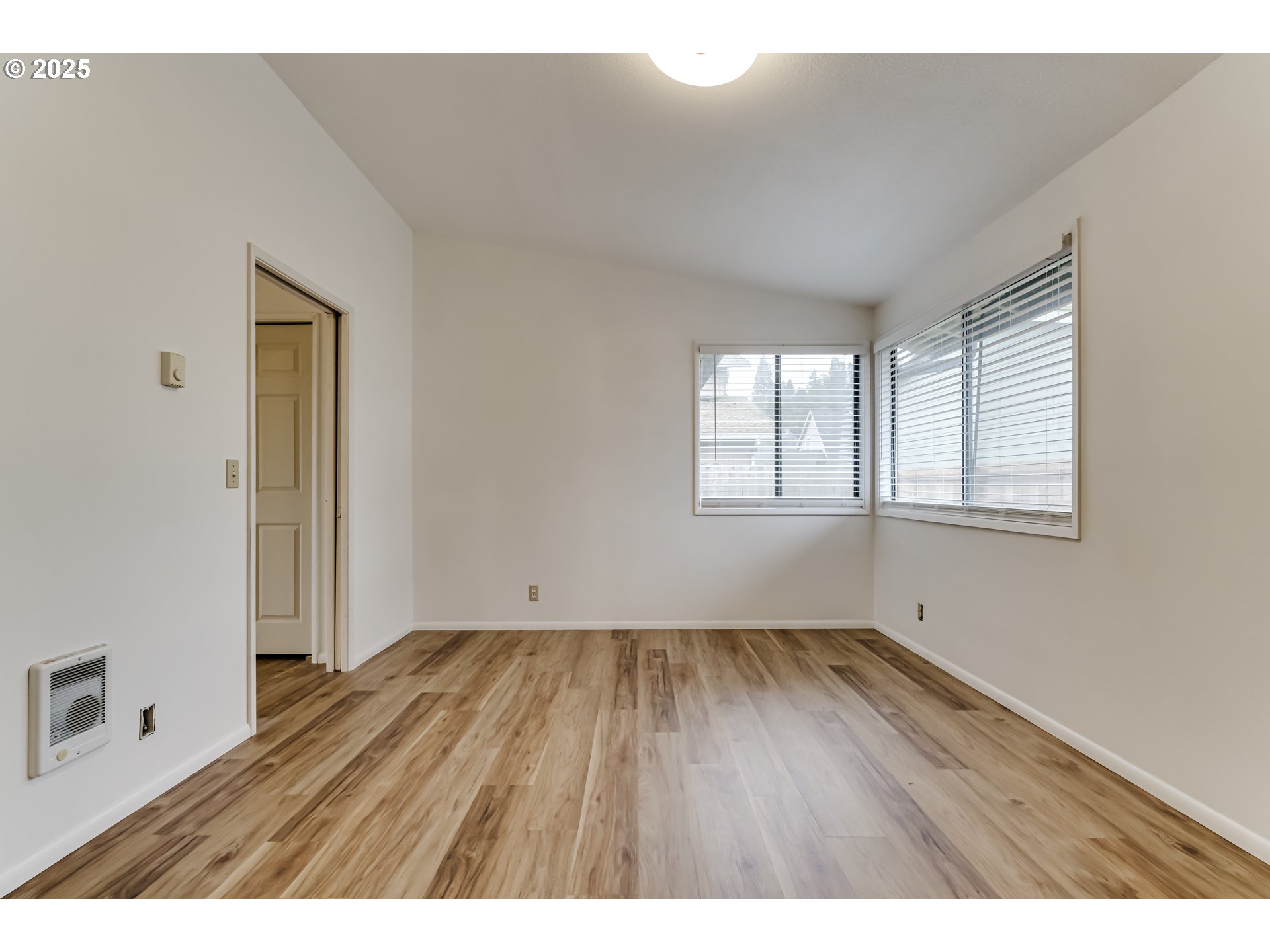 6865 Main Street Springfield, OR 97478 - Photo 39 of 48 a view of an empty room with wooden floor and a window