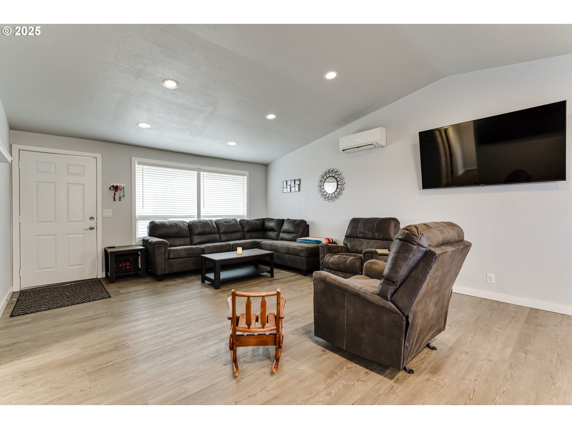 6865 Main Street Springfield, OR 97478 - Photo 4 of 48 a living room with furniture and a flat screen tv