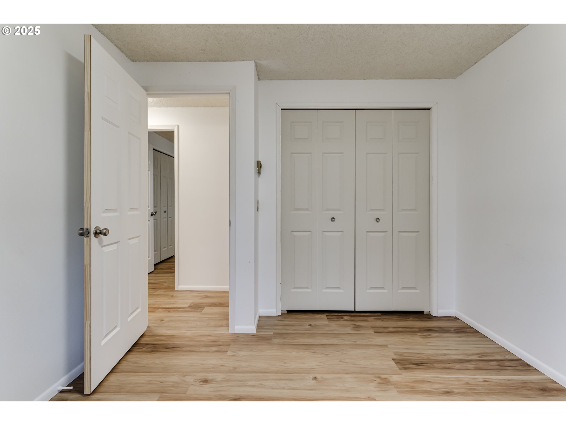 6865 Main Street Springfield, OR 97478 - Photo 44 of 48 a view of an empty room with wooden floor