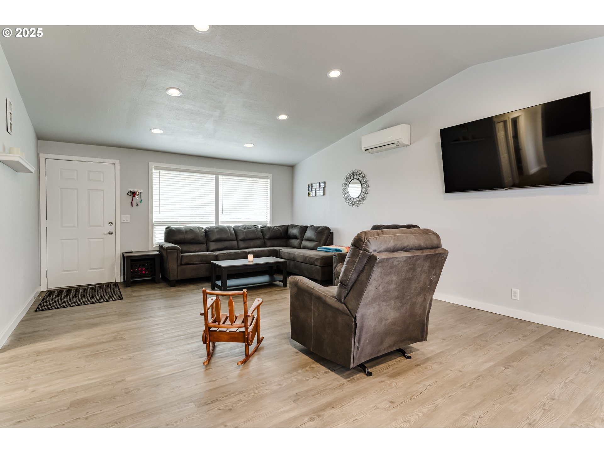6865 Main Street Springfield, OR 97478 - Photo 5 of 48 a living room with furniture and a flat screen tv
